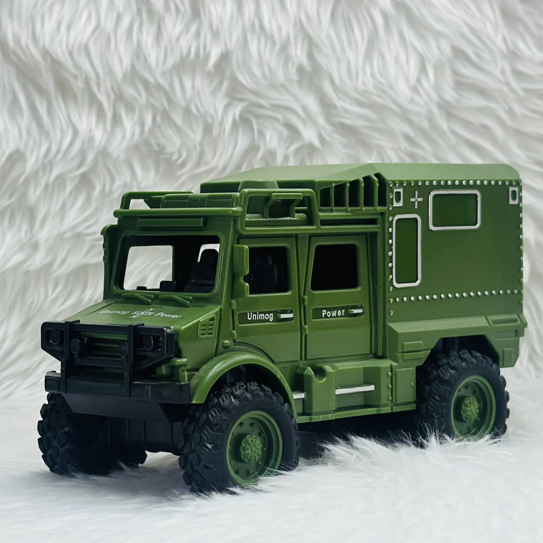 Toy Club Unimog army truck toy.