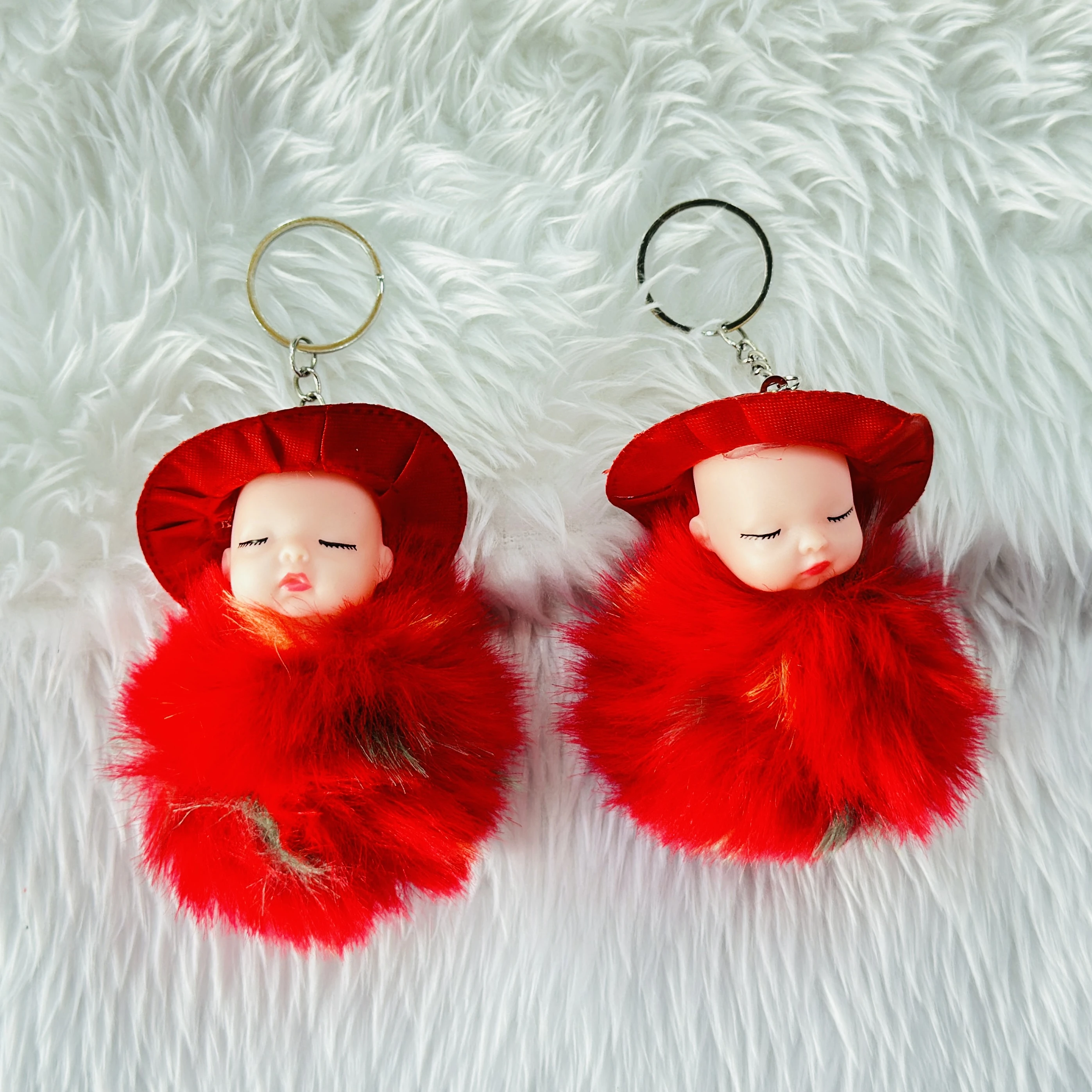 SRG Cute Sleeping Furry Baby doll with cap" keychain