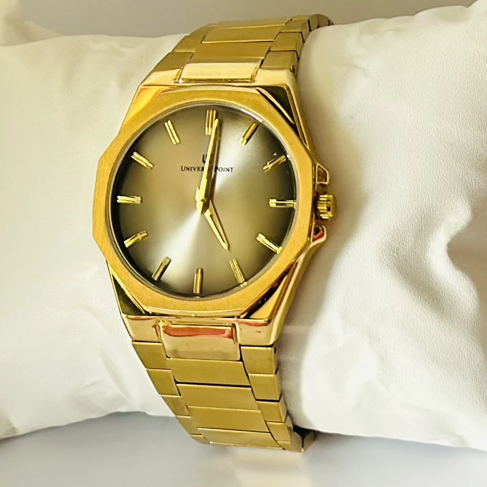 Analog Watch with a golden dial and stainless steel strap