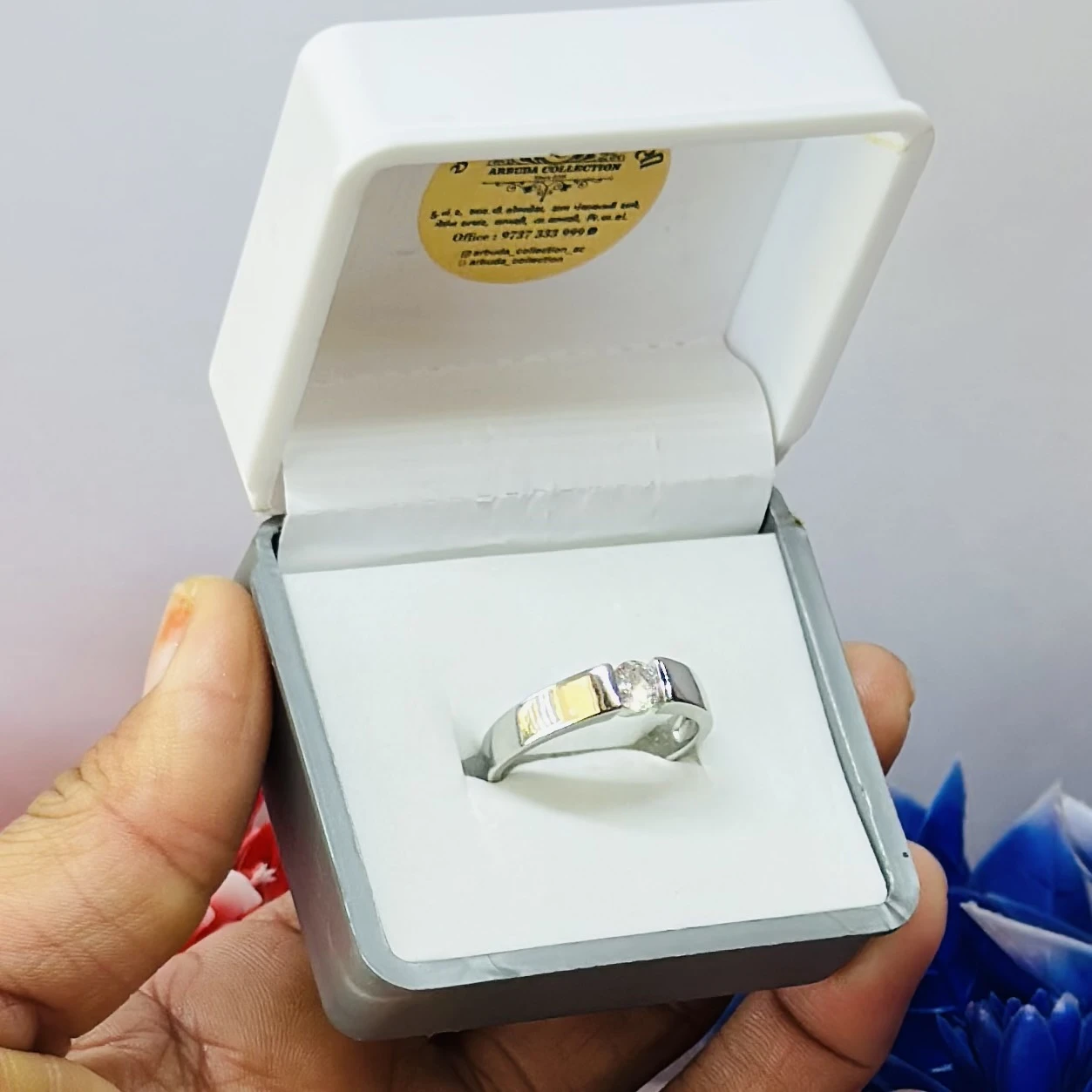 silver solitaire ring with a modern tension-style