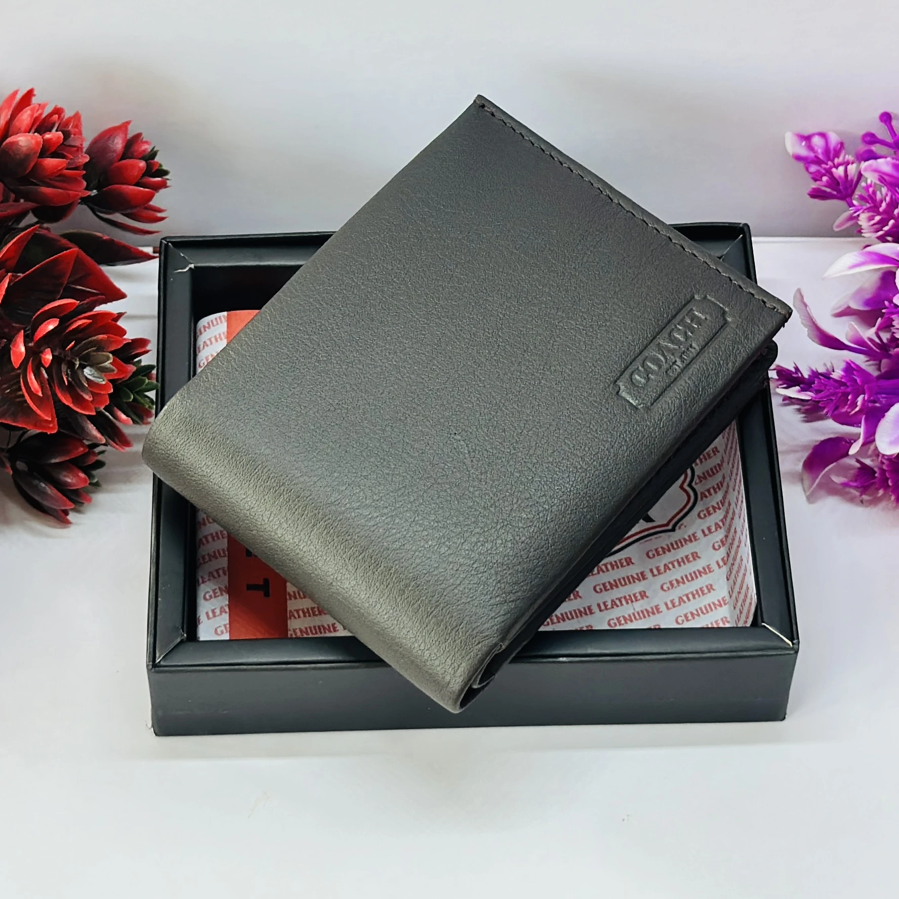 Coach men's black leather slim bifold wallet.