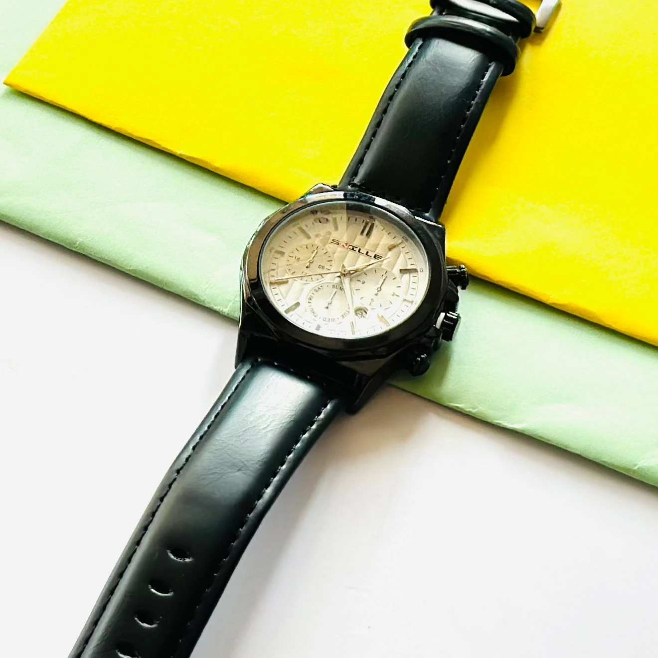 Forest quartz analog watch with a gold-tone mesh strap and a white dial.
