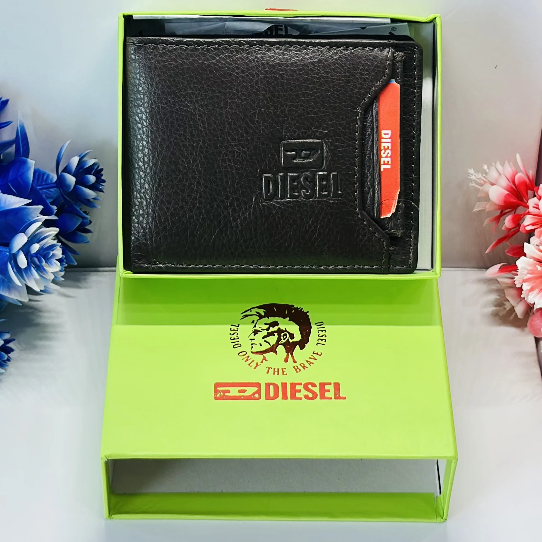 Diesel bi-fold wallet in black grainy leather.