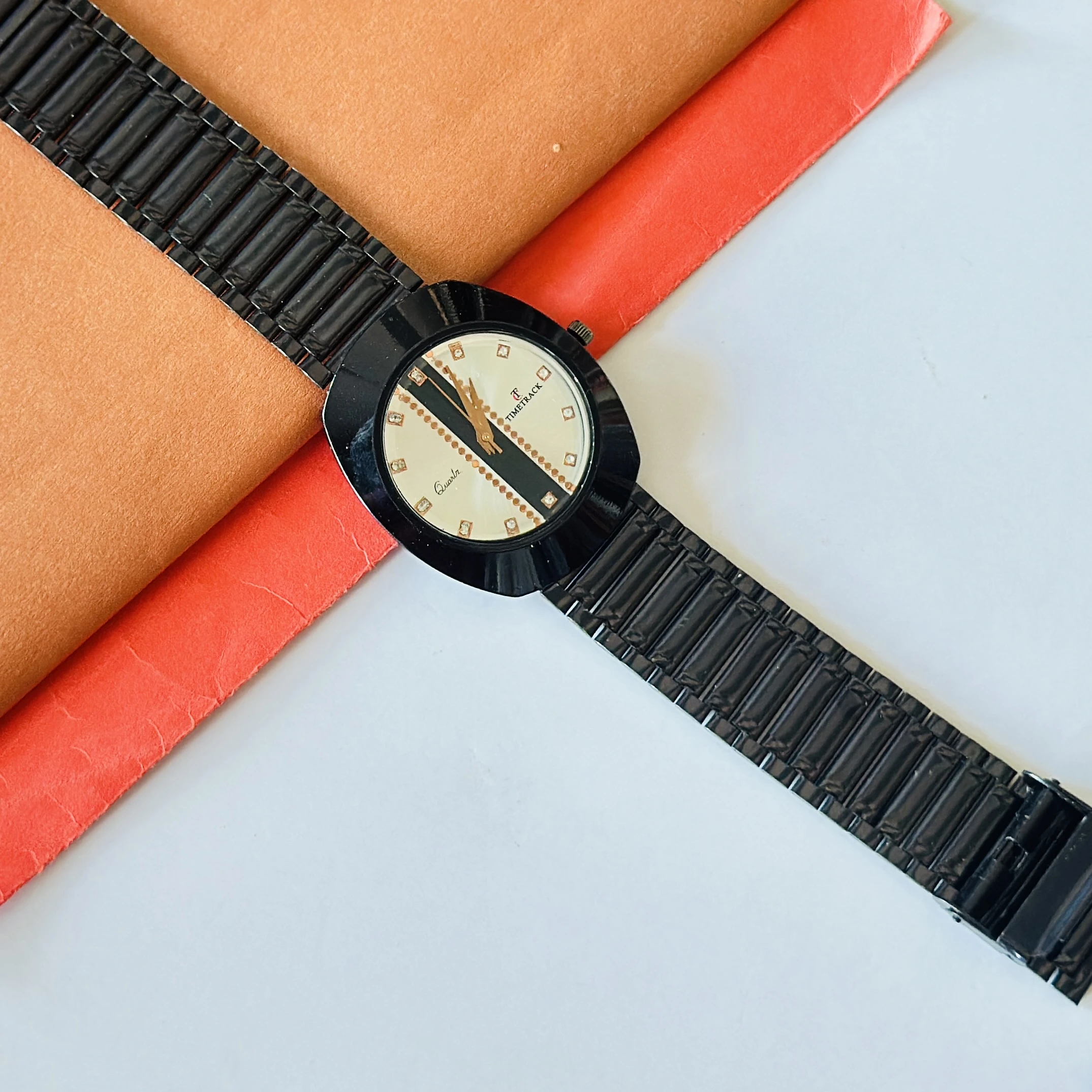 Diastar analog watch with a black metal strap and a silver dial