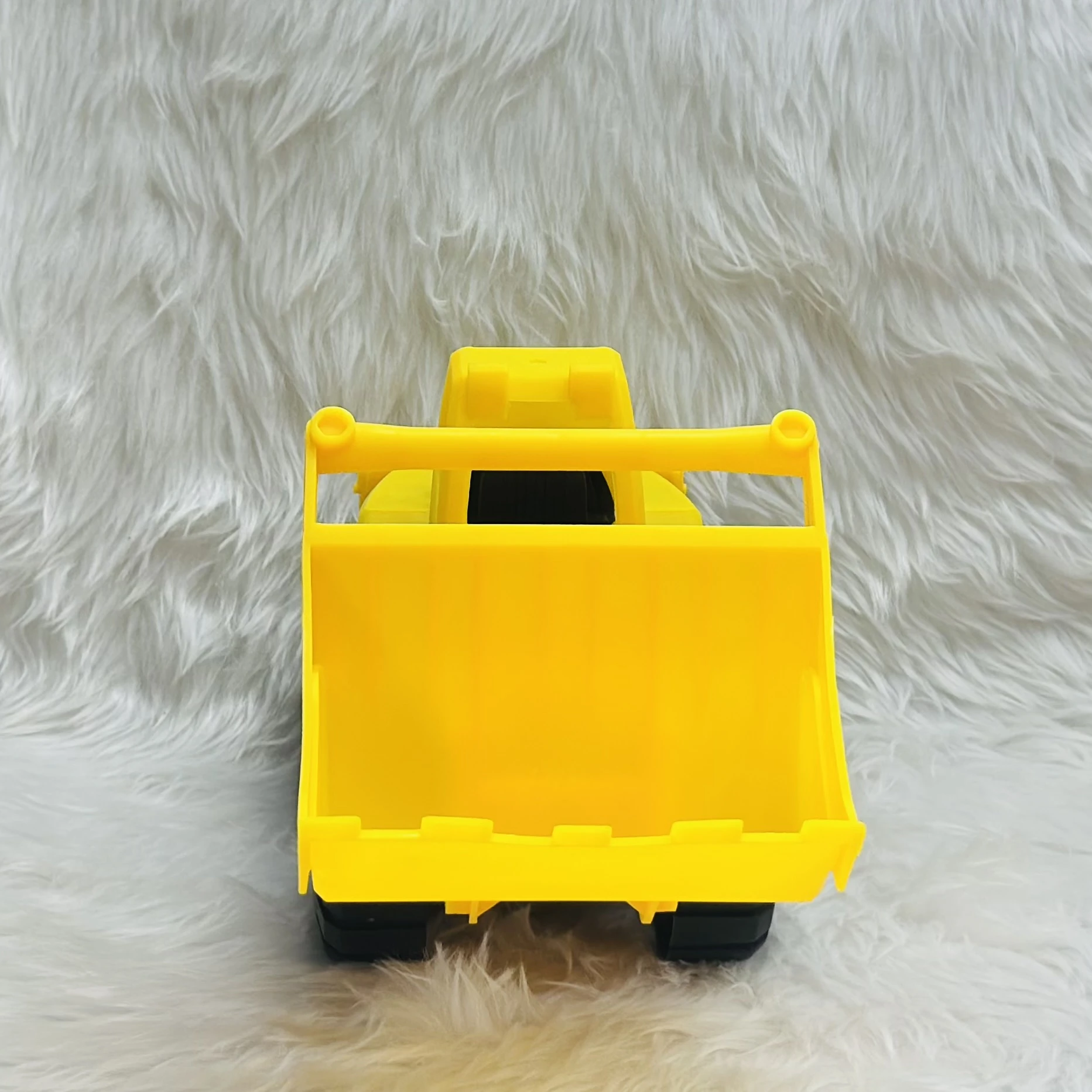 Yellow toy wheel loader,