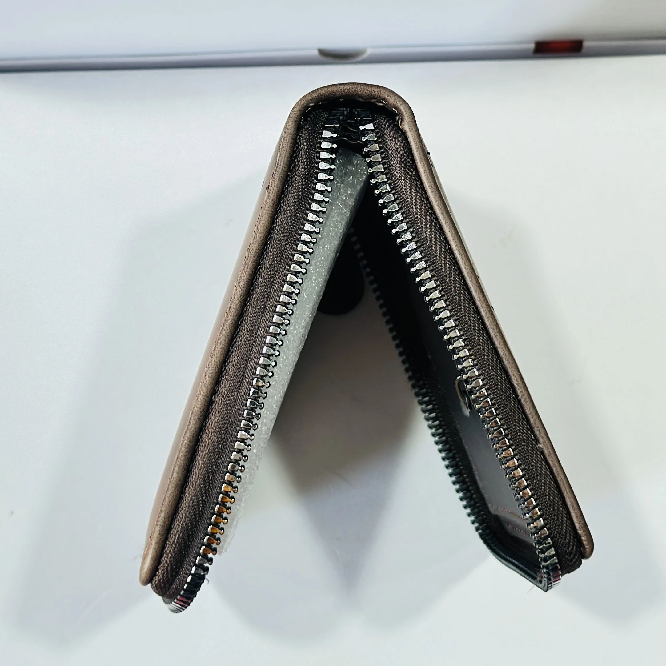 Balisi Style leather wallet is a brown, bi-fold designer zippered wallet for men.