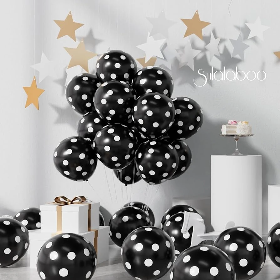 package of black party balloons with white polka dots.