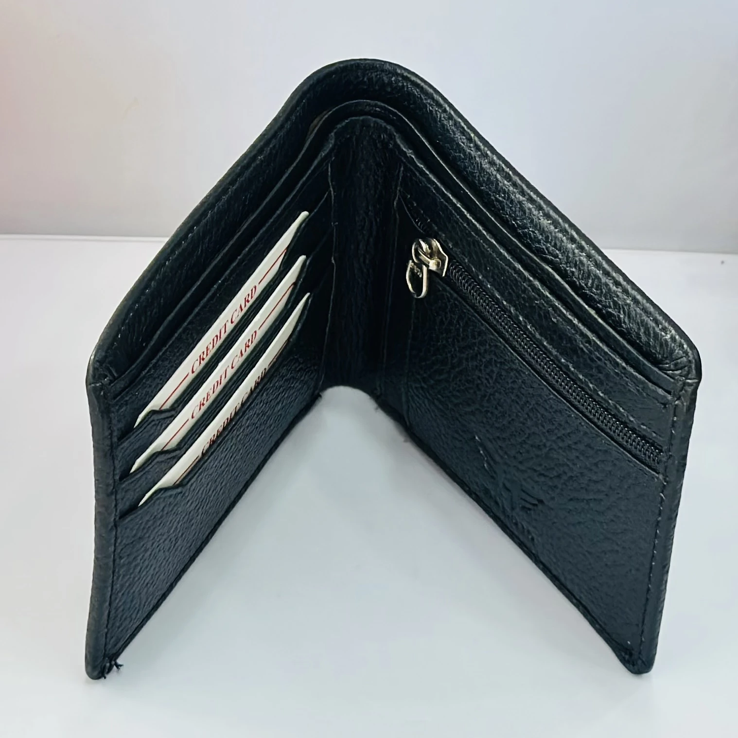 PUMA men's bi-fold leather wallet in black.