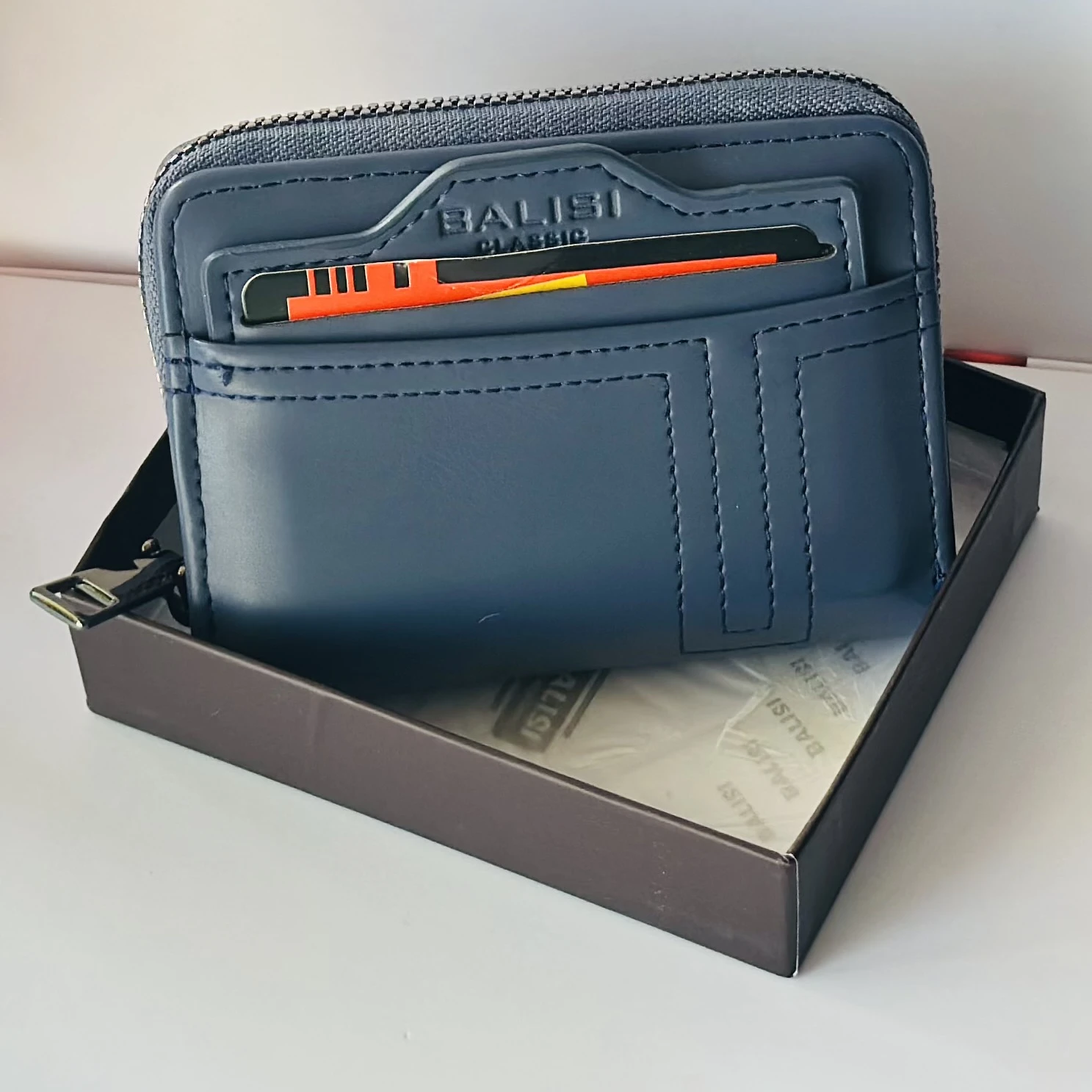 Balisi plain zip button men's wallet in a blue color, likely made of PU leather.