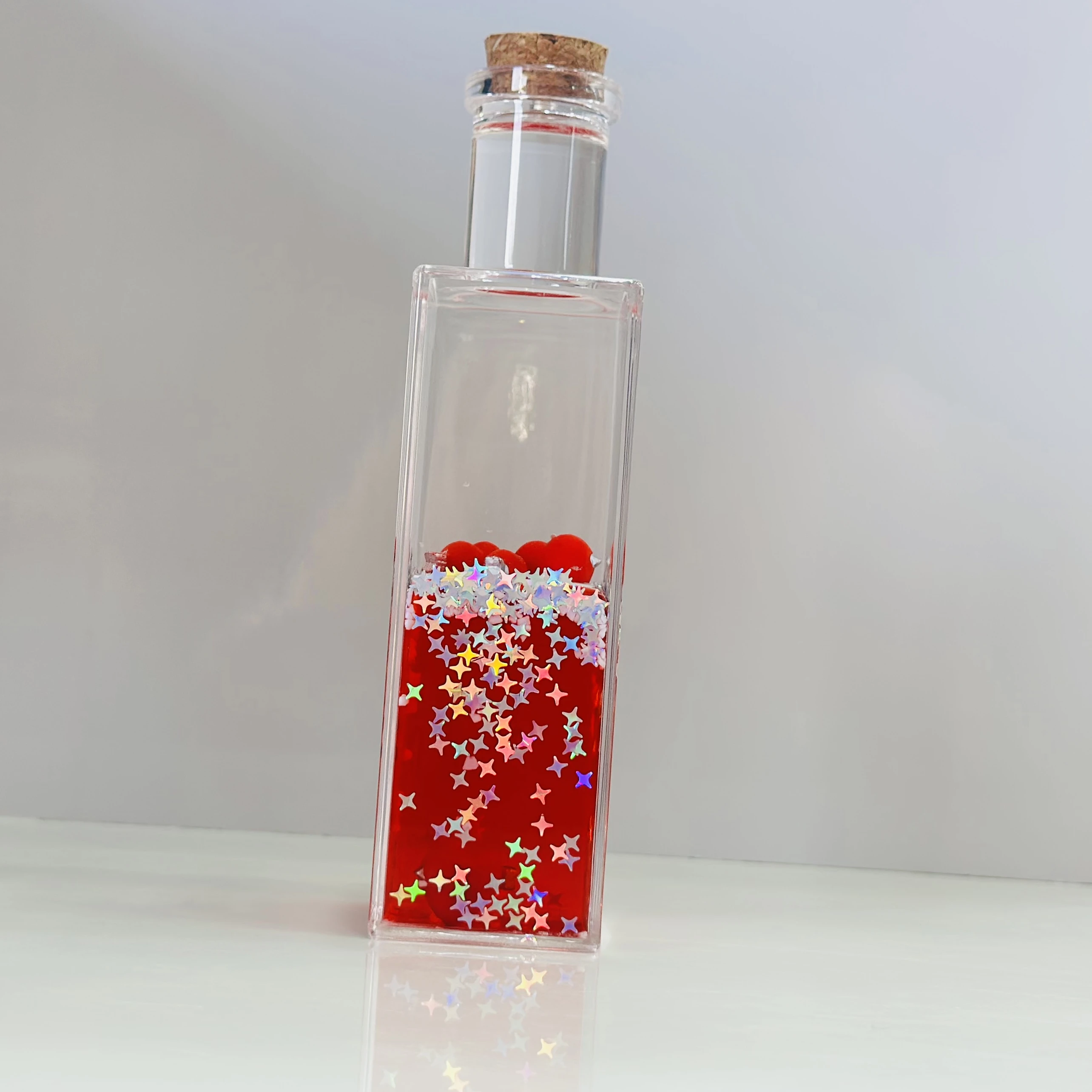 decorative fluid bottle with hearts and stars. (SKU-S4IER4)