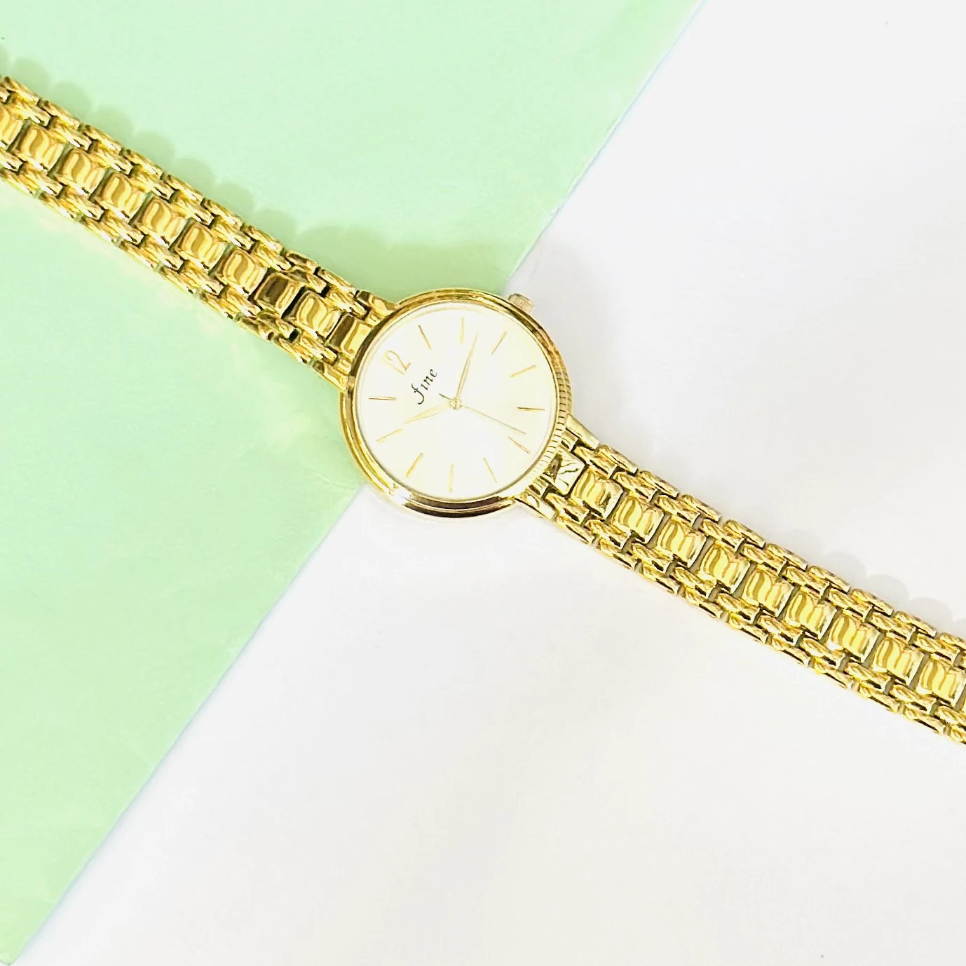 Gold tone women's analog watch