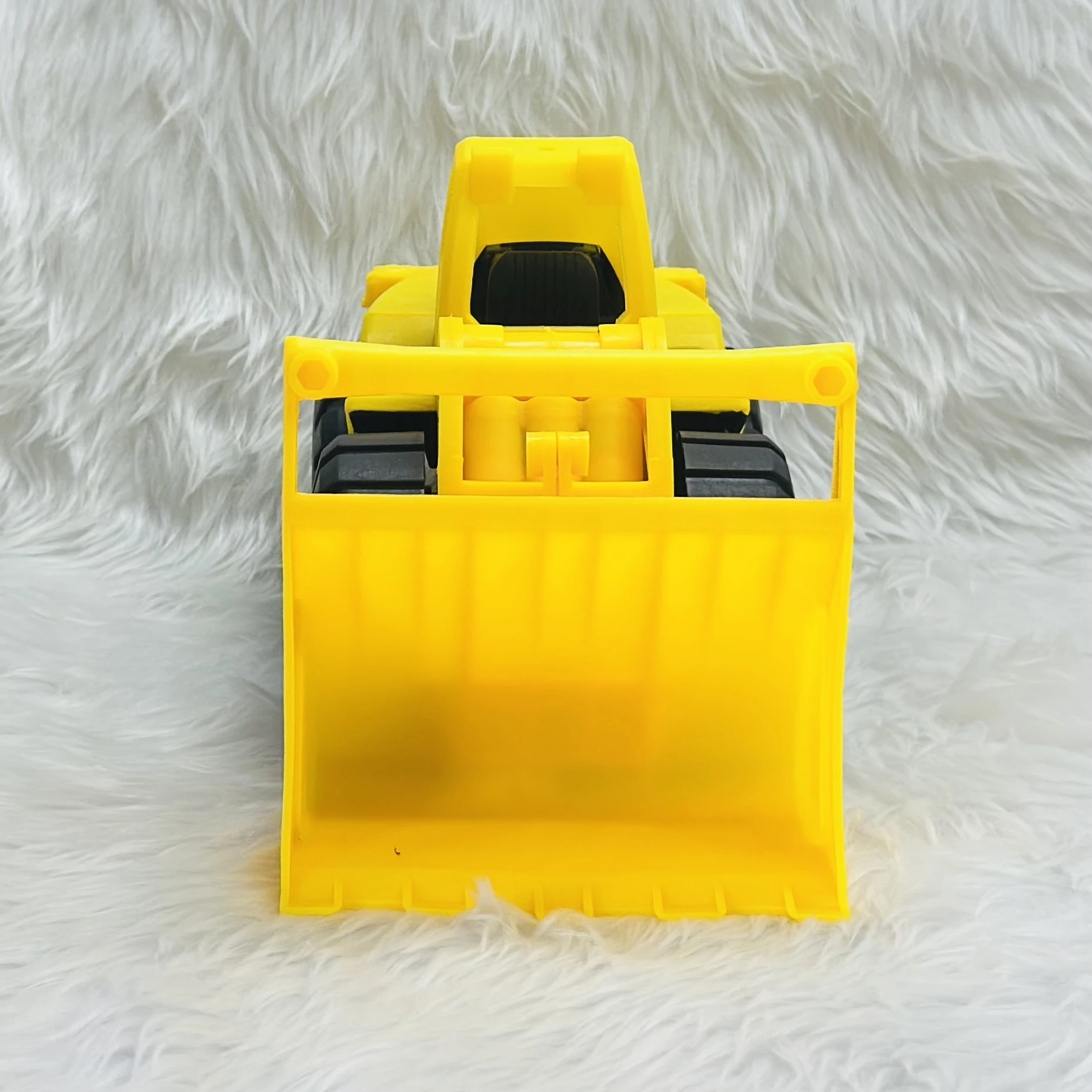 Yellow toy wheel loader,
