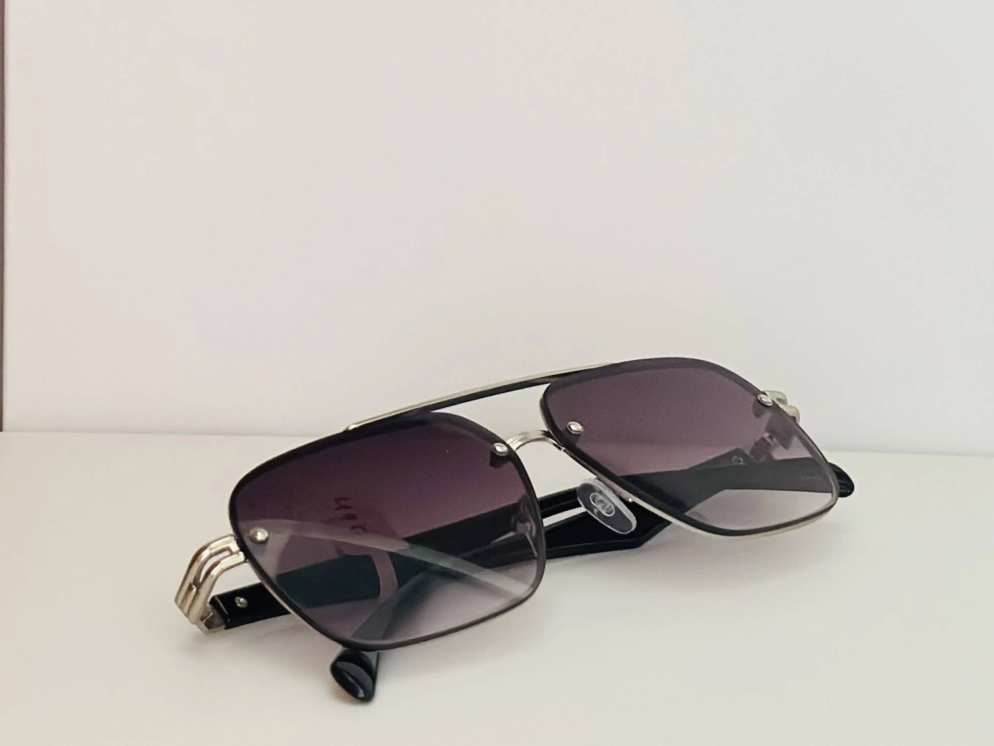 gradient square sunglasses with a black frame.