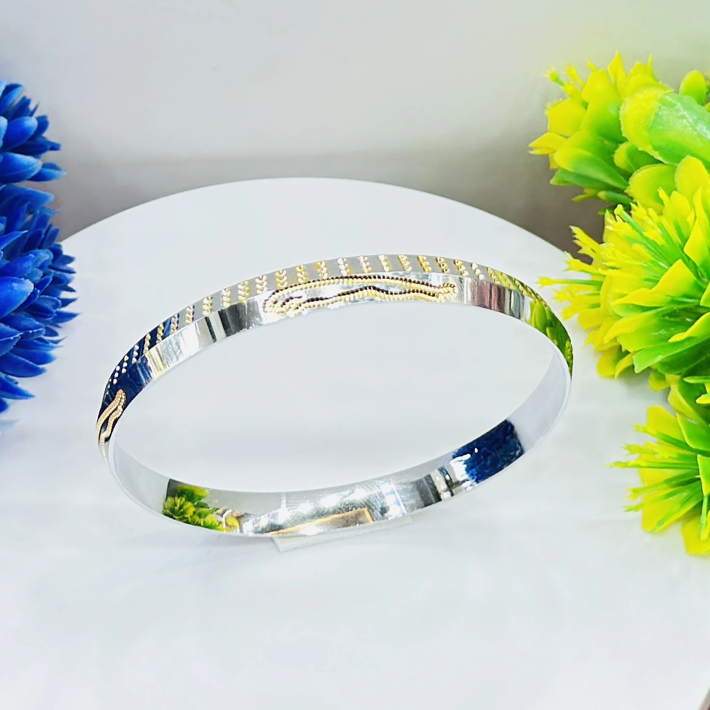silver dual-tone men's kada with gold plating, featuring a polished finish.