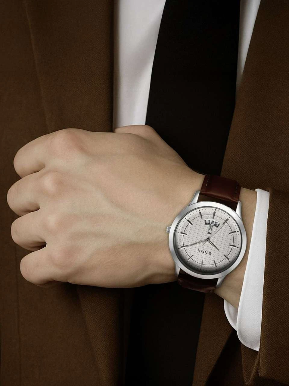 Titan On Trend analog watch featuring a clean white dial and a brown leather strap