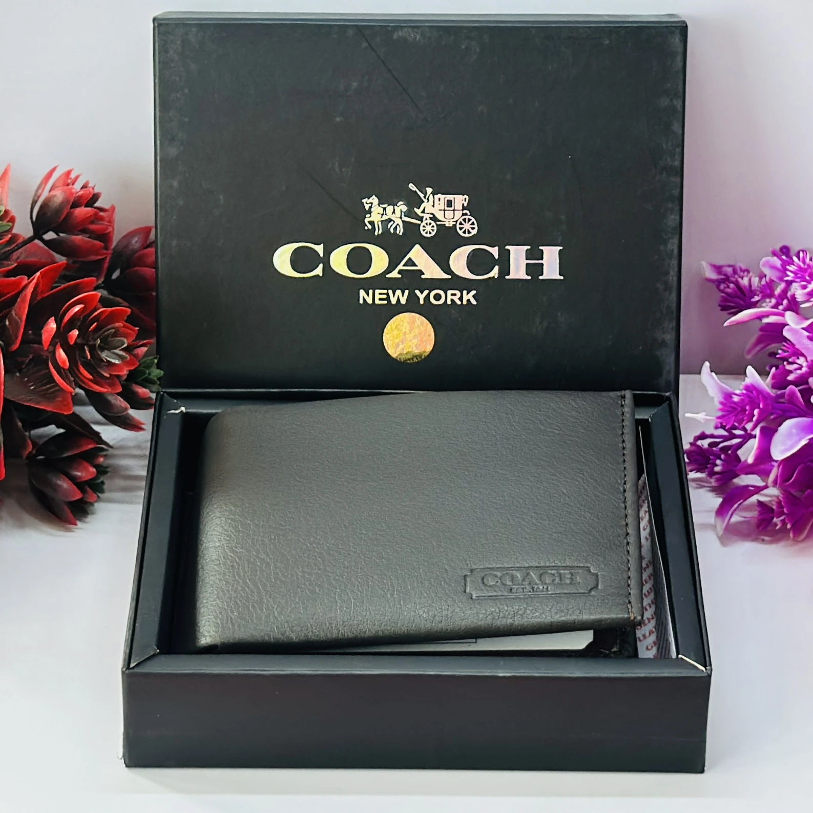 Coach men's black leather slim bifold wallet.