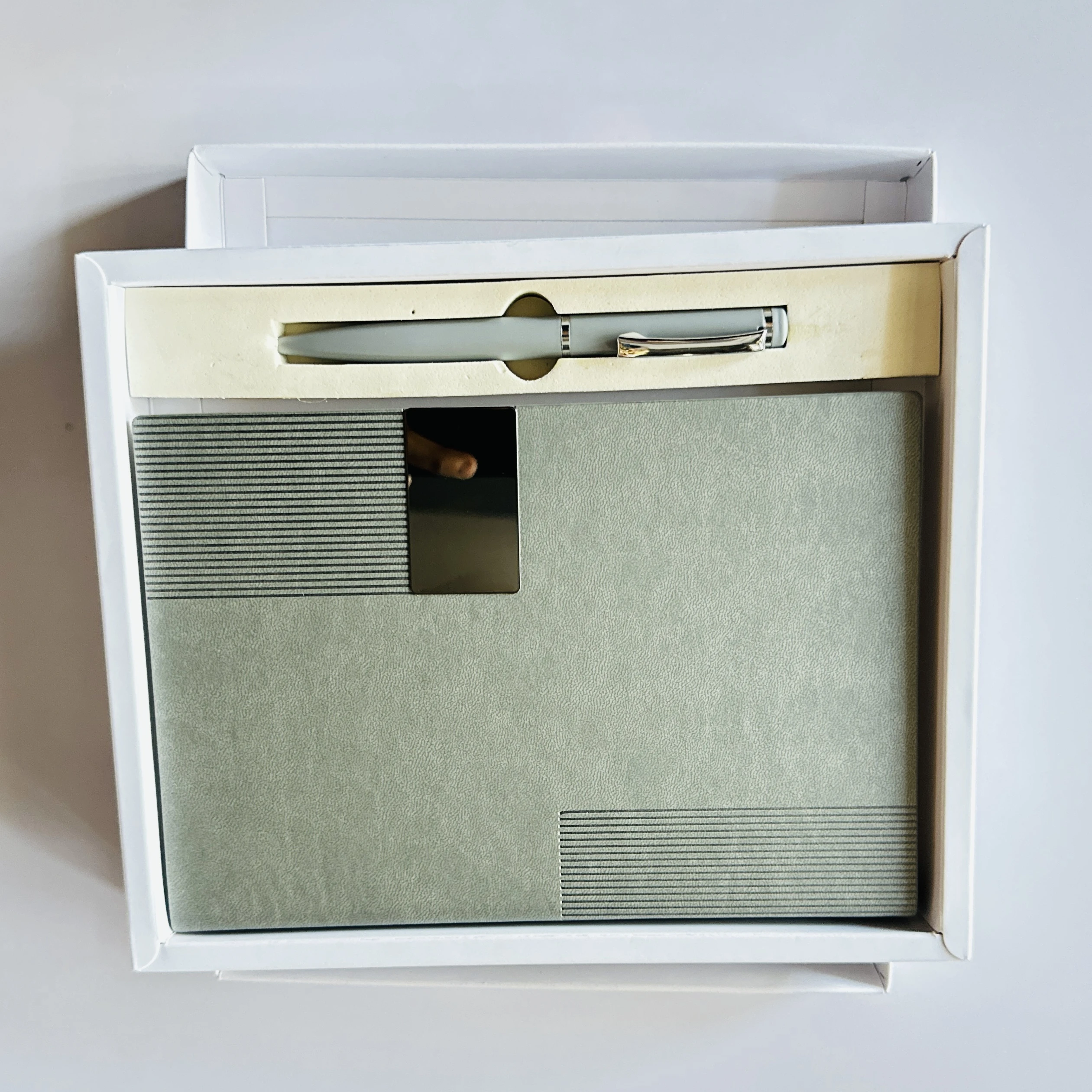 grey textured hardbound notebook and metal ballpoint pen corporate gift set.