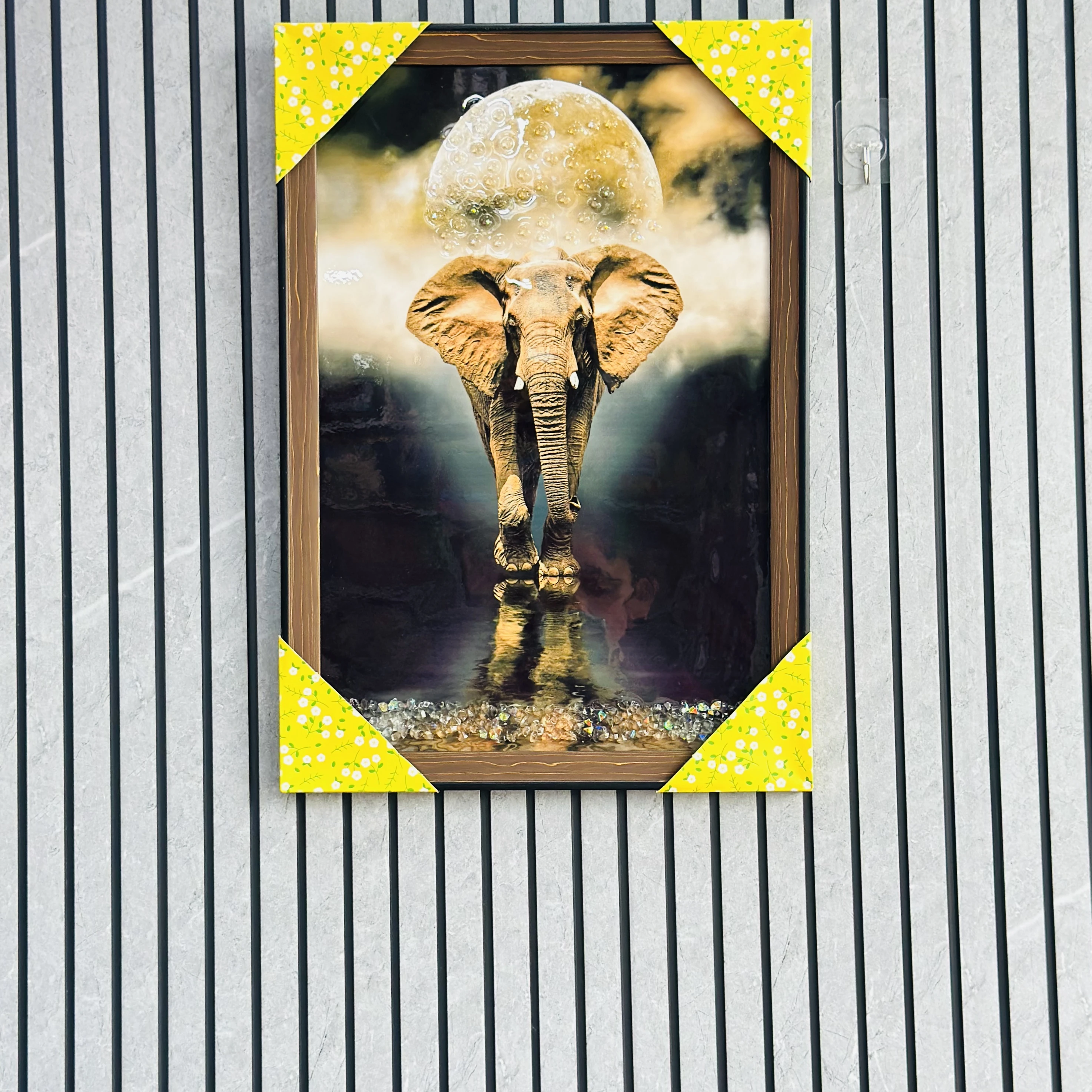 An elephant walking under a large moon(SKU-0OUCTP)
