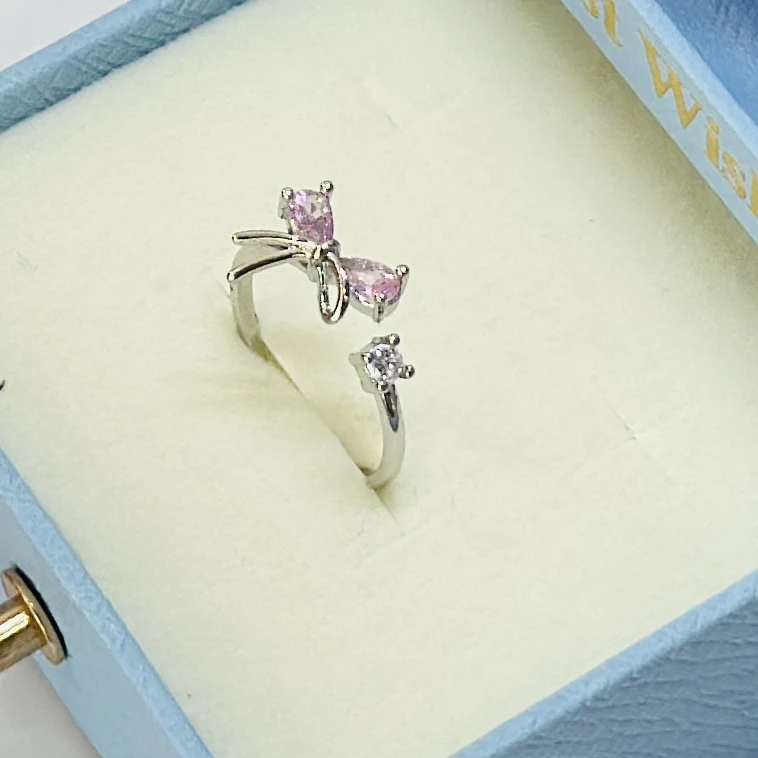 silver mini bow tie adjustable ring for women.