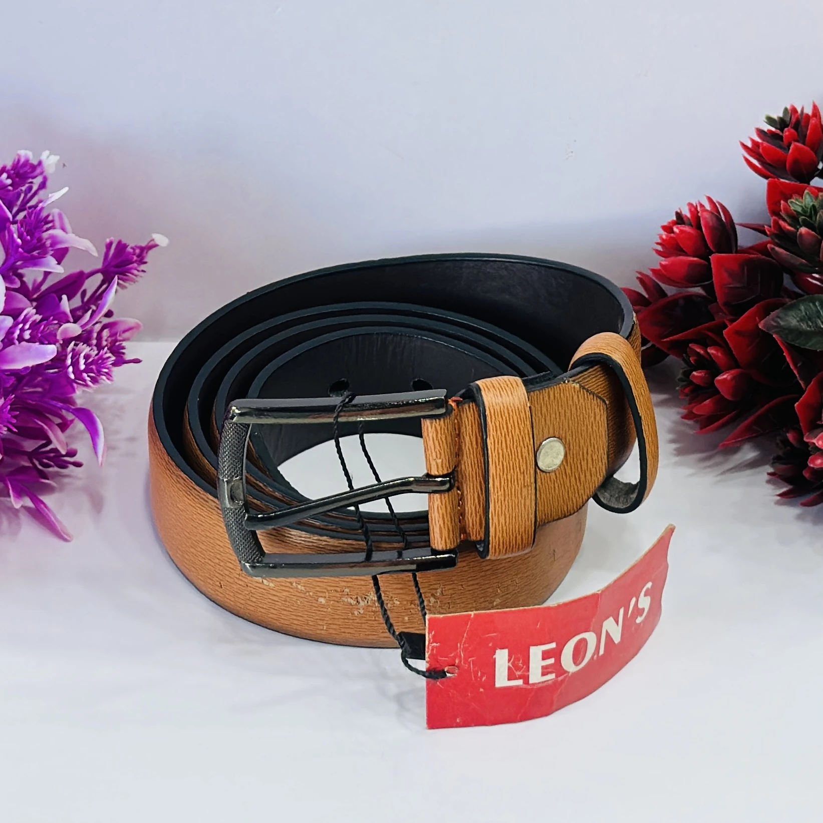 Tan  textured leather belt for men.