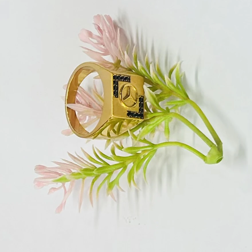 Men’s ring featuring the Mercedes-Benz logo and black accent stones