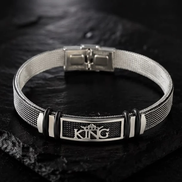 Men Style stainless steel mesh bracelet features a "KING" crown emblem and a buckle clasp.