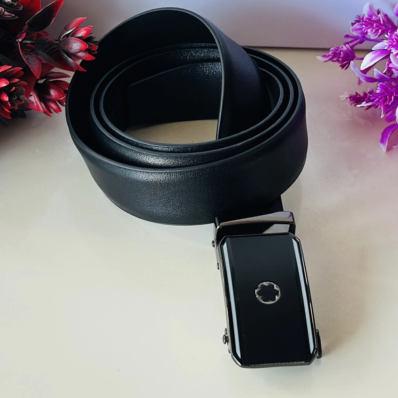 Black textured synthetic leather belt