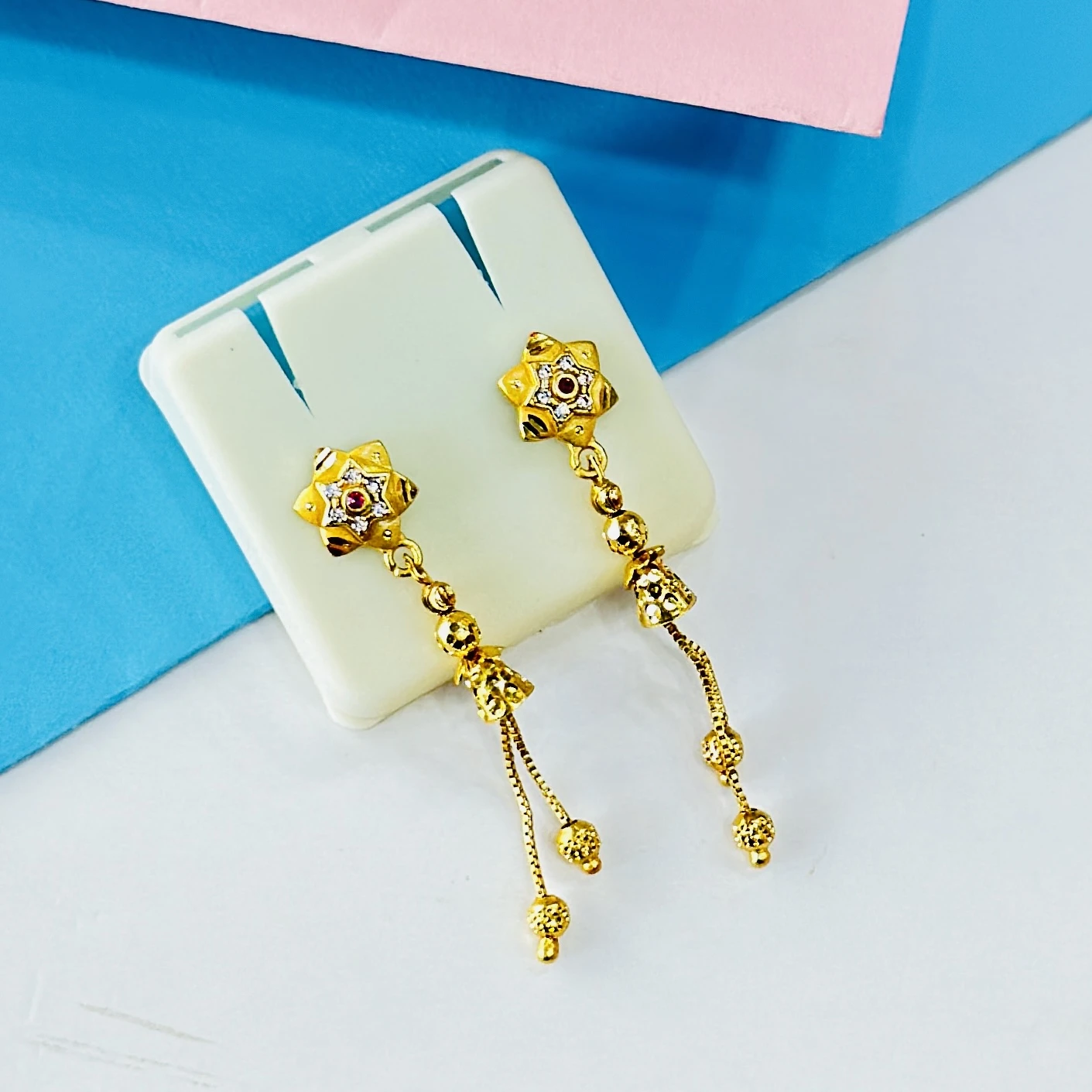 pair of intricate gold drop earrings