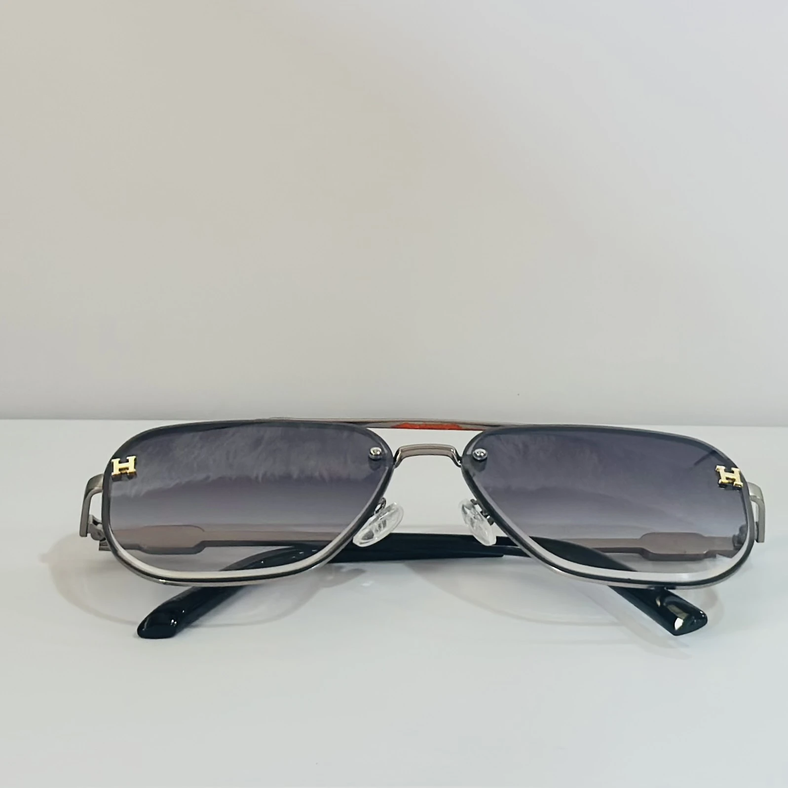 pair of Maybach aviator sunglasses with black and gold details.