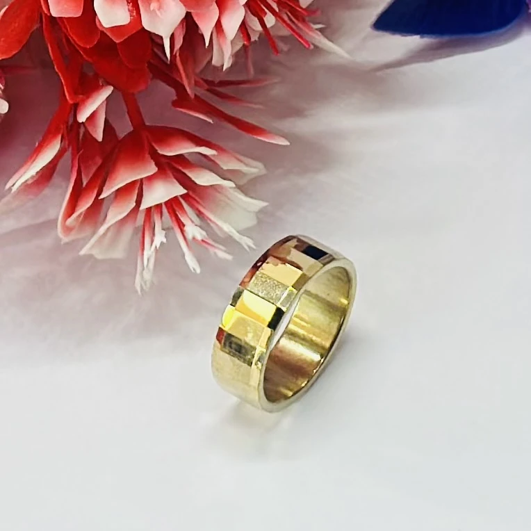 gold-plated highly polished tungsten carbide faceted band ring.