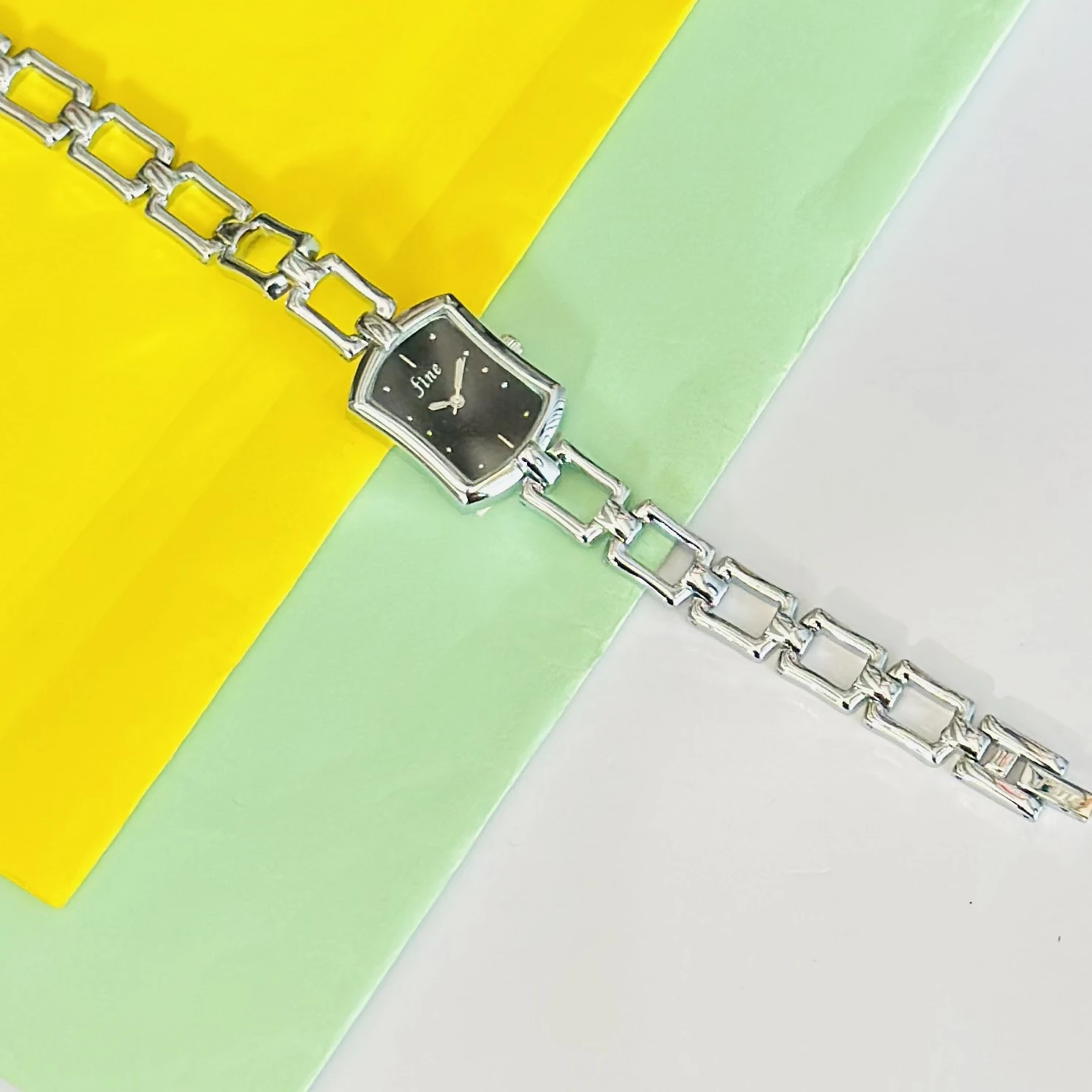 women's analog watch with a silver-tone metal case and a matching link bracelet strap