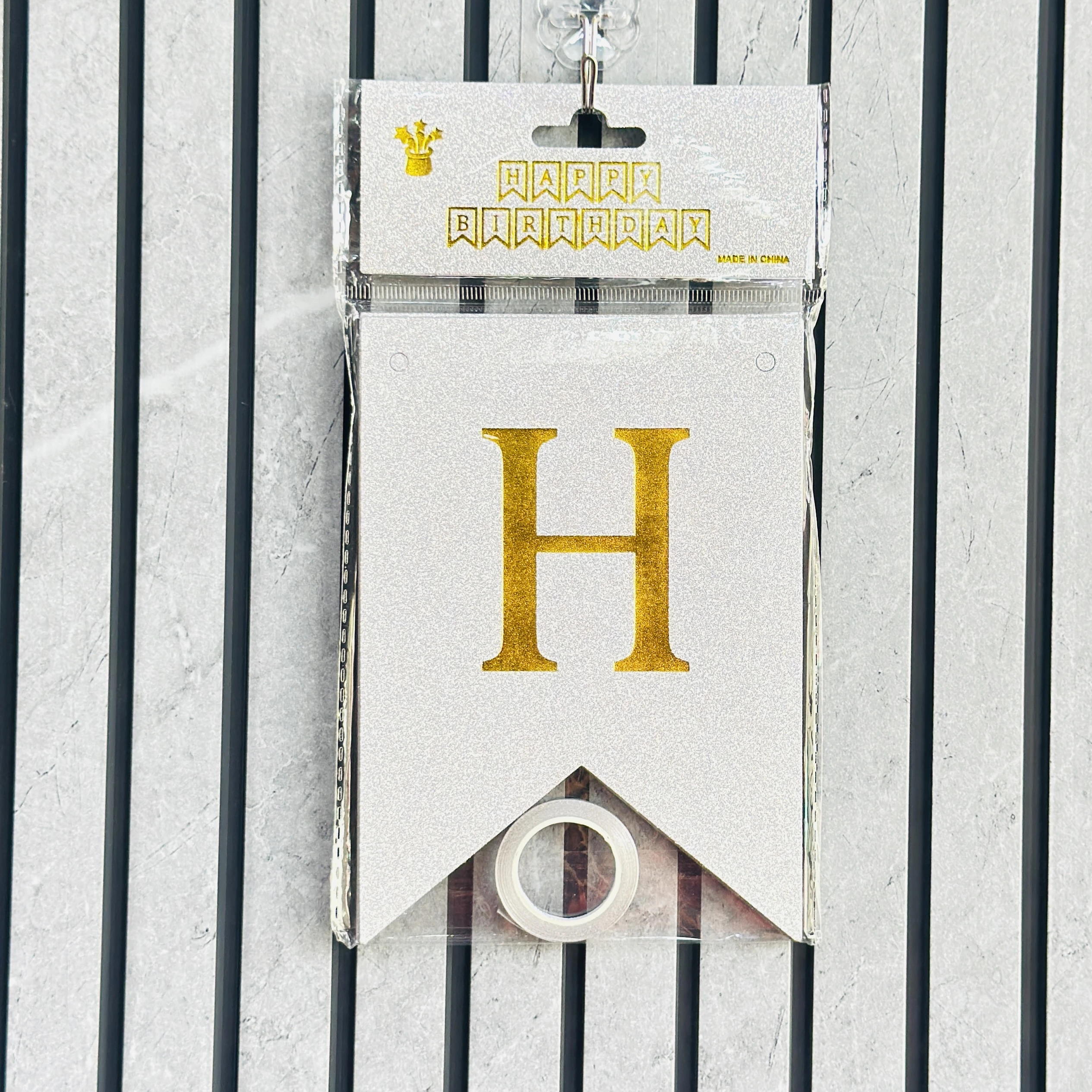 silver glitter "Happy Birthday" banner with gold letters.