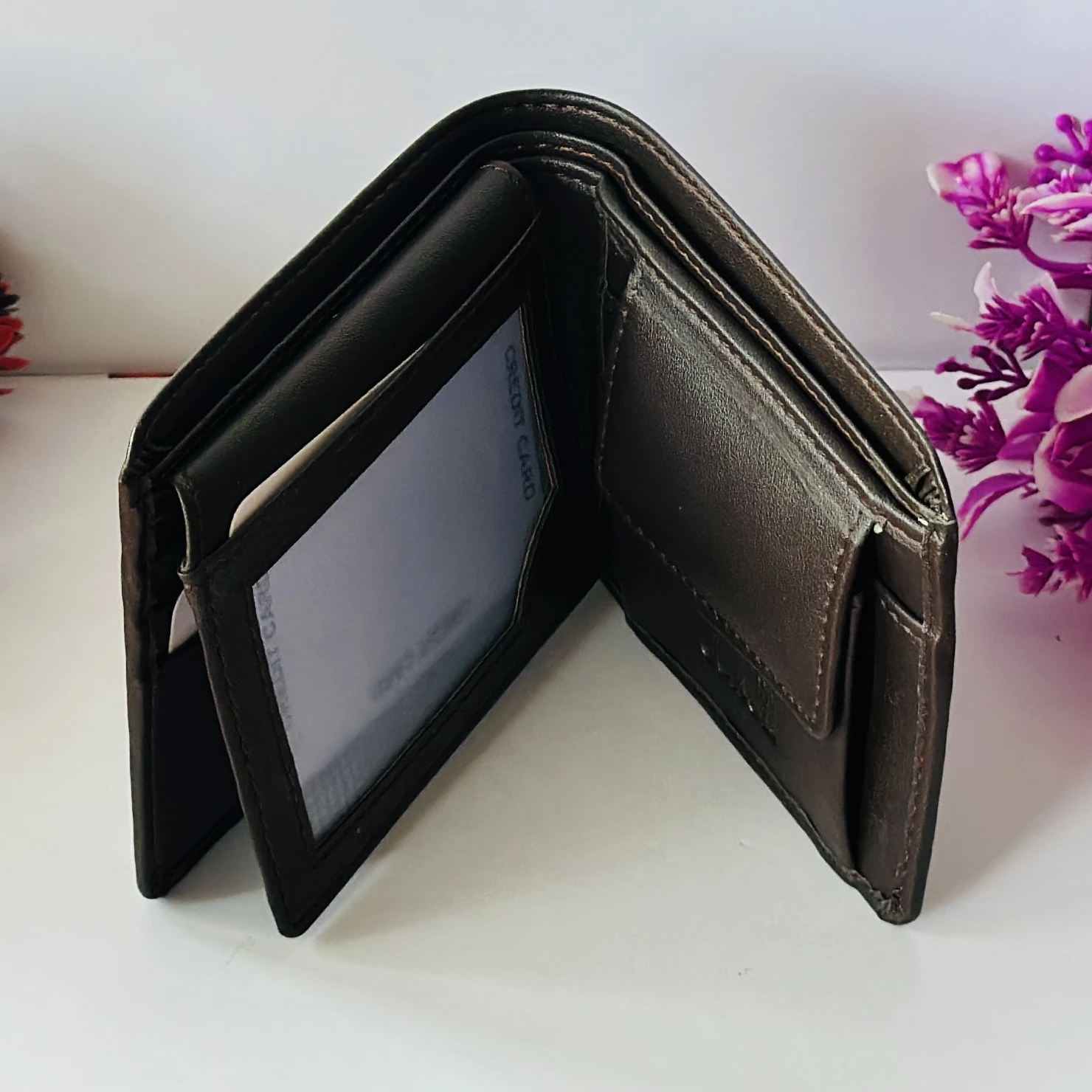 Brown Coach bifold wallet.