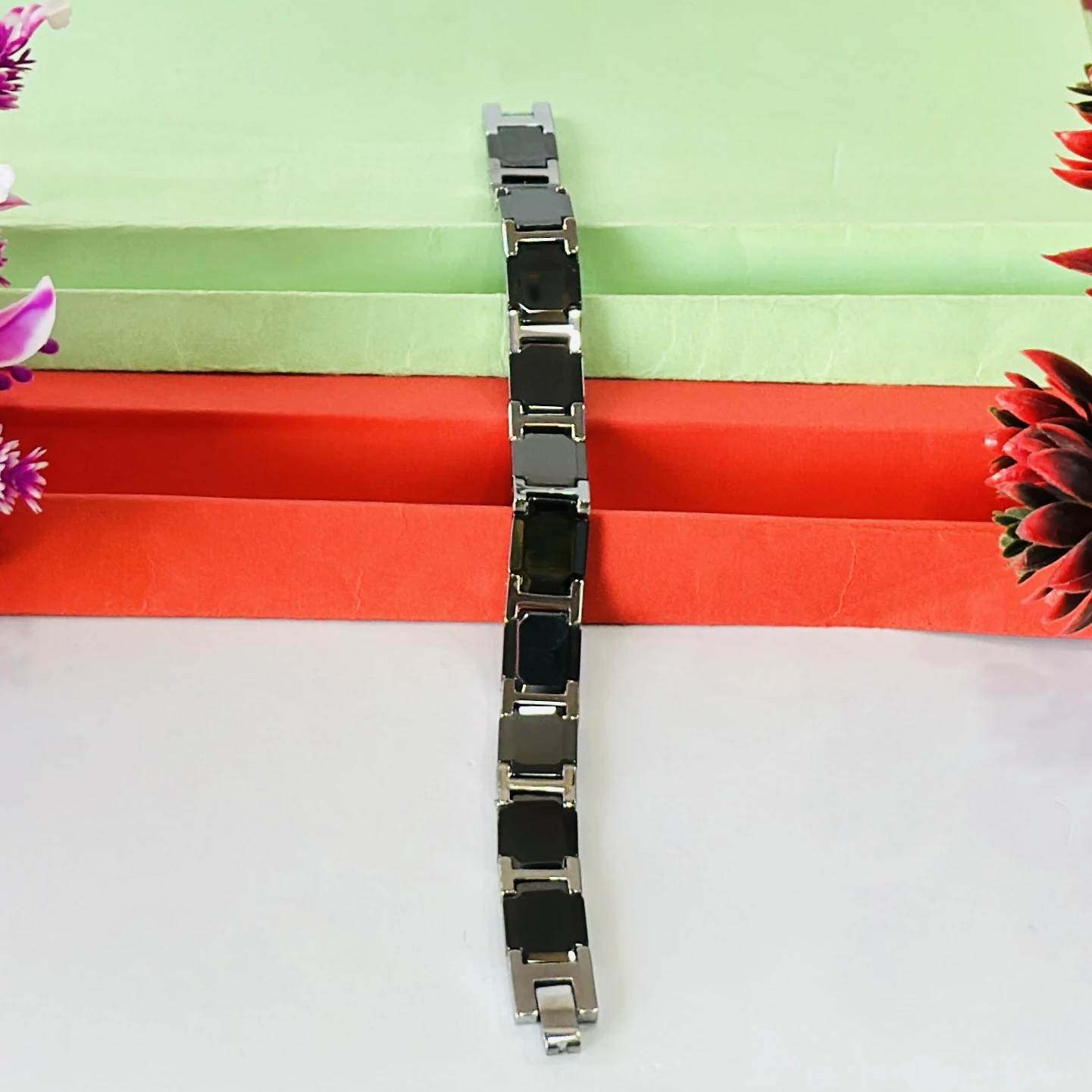 men's stainless steel and black ceramic (or rubber) link bracelet.