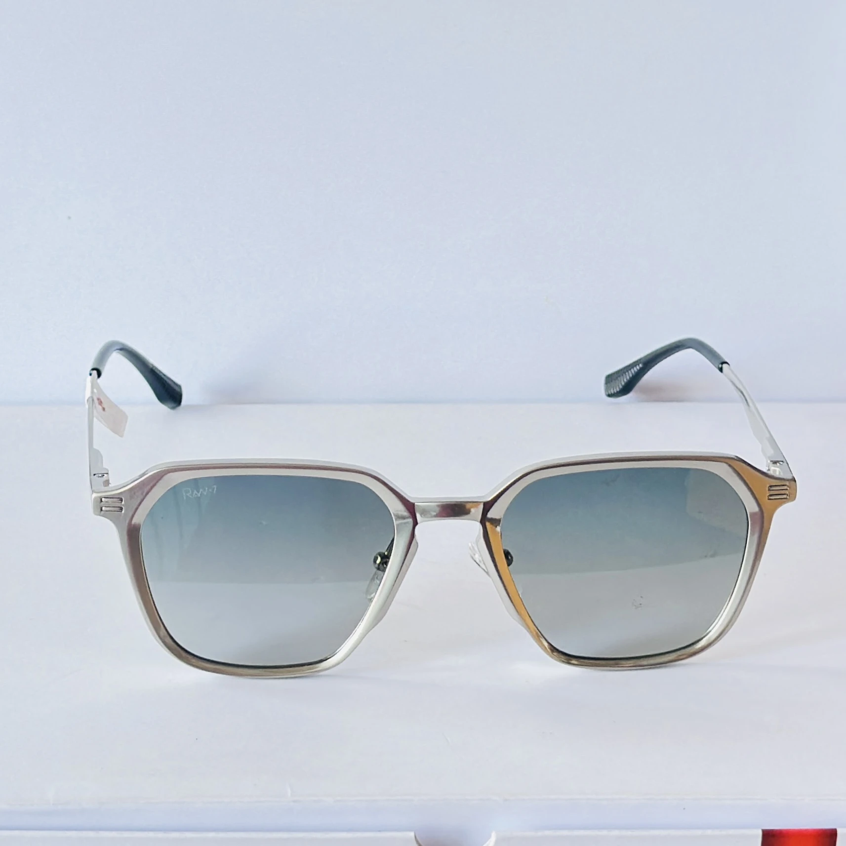 RAV-7 sunglasses feature a sleek black full-rim rectangle frame