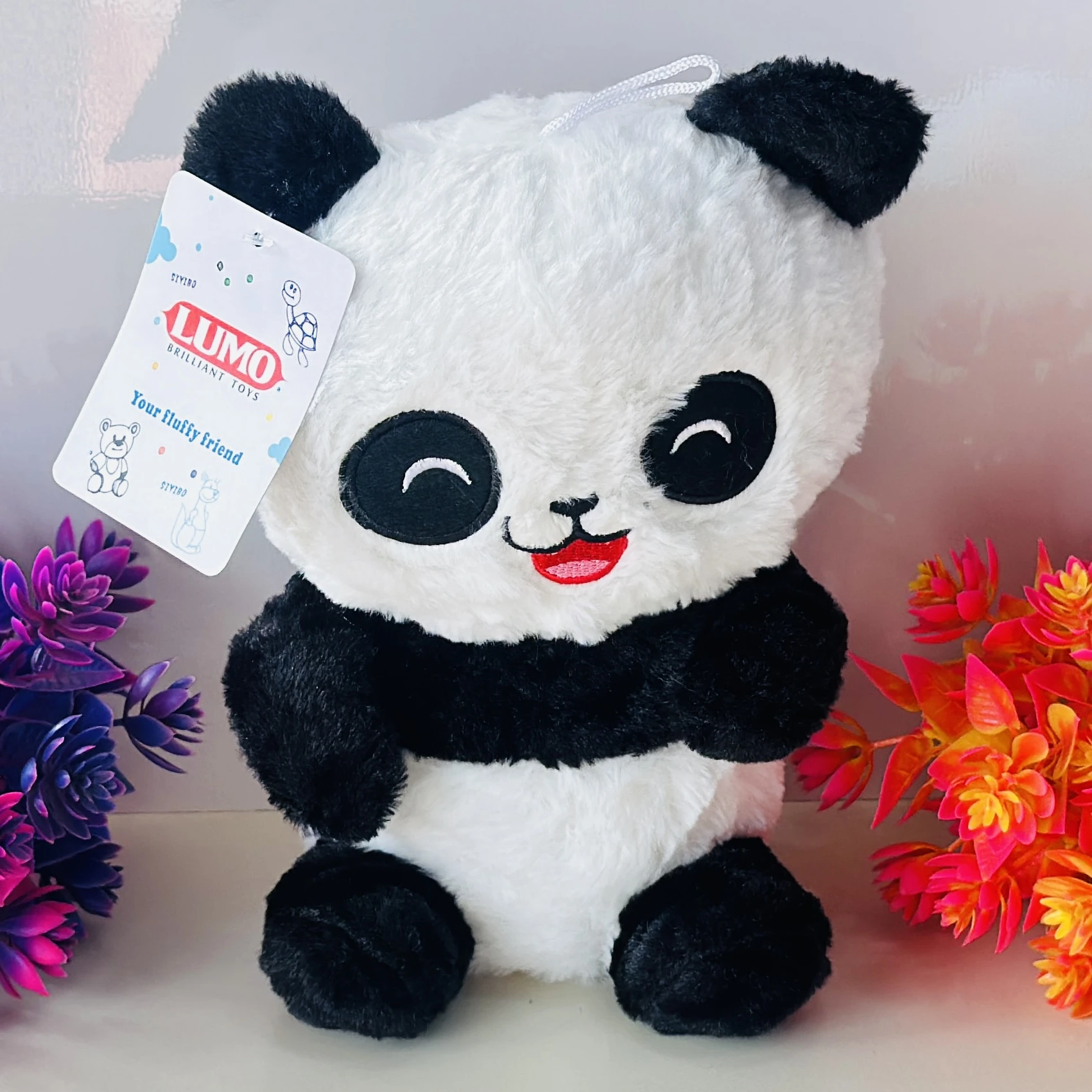 LUMO Brilliant Toys panda soft toy.