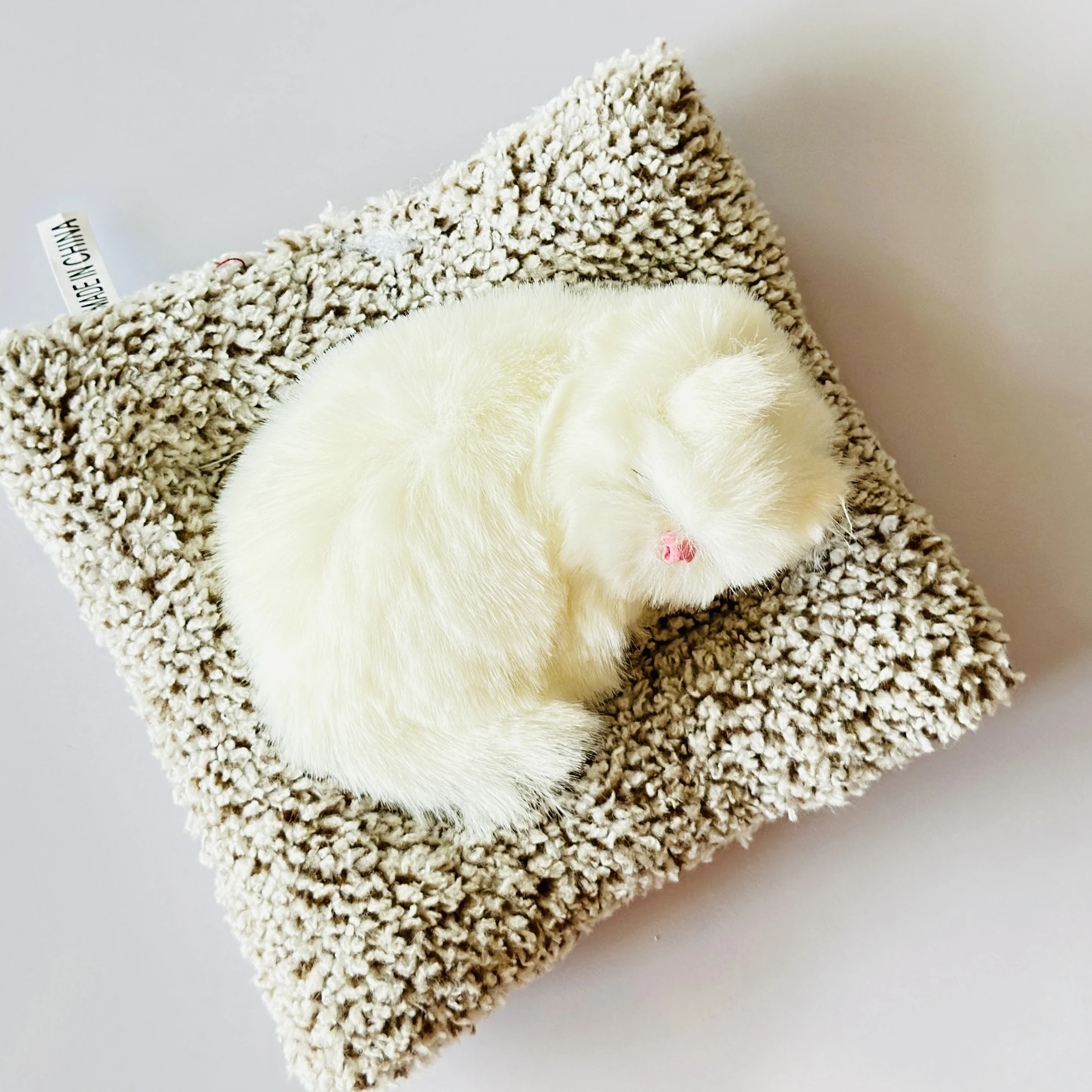 decorative sleeping cat figurine designed for car dashboards or home decor