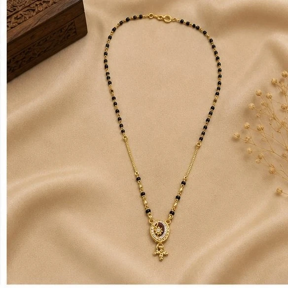 stylish mangalsutra features a circular pendant