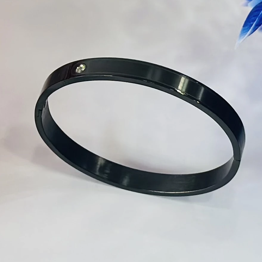 Black stainless steel kada bracelet with a diamond accent.