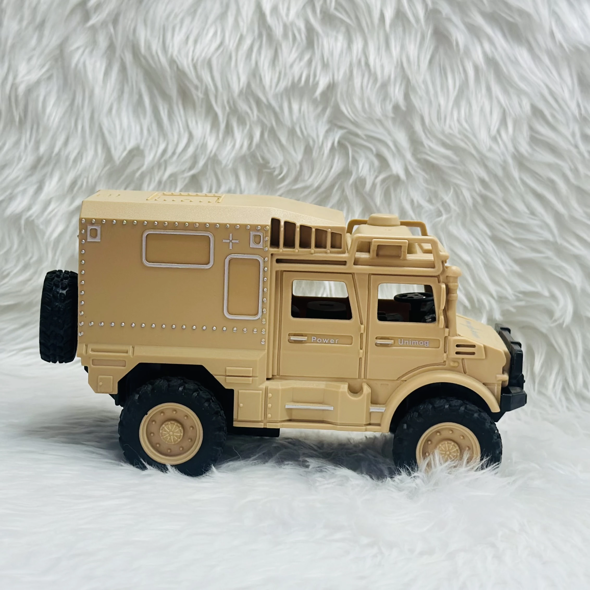 Toy Club Unimog army truck toy.