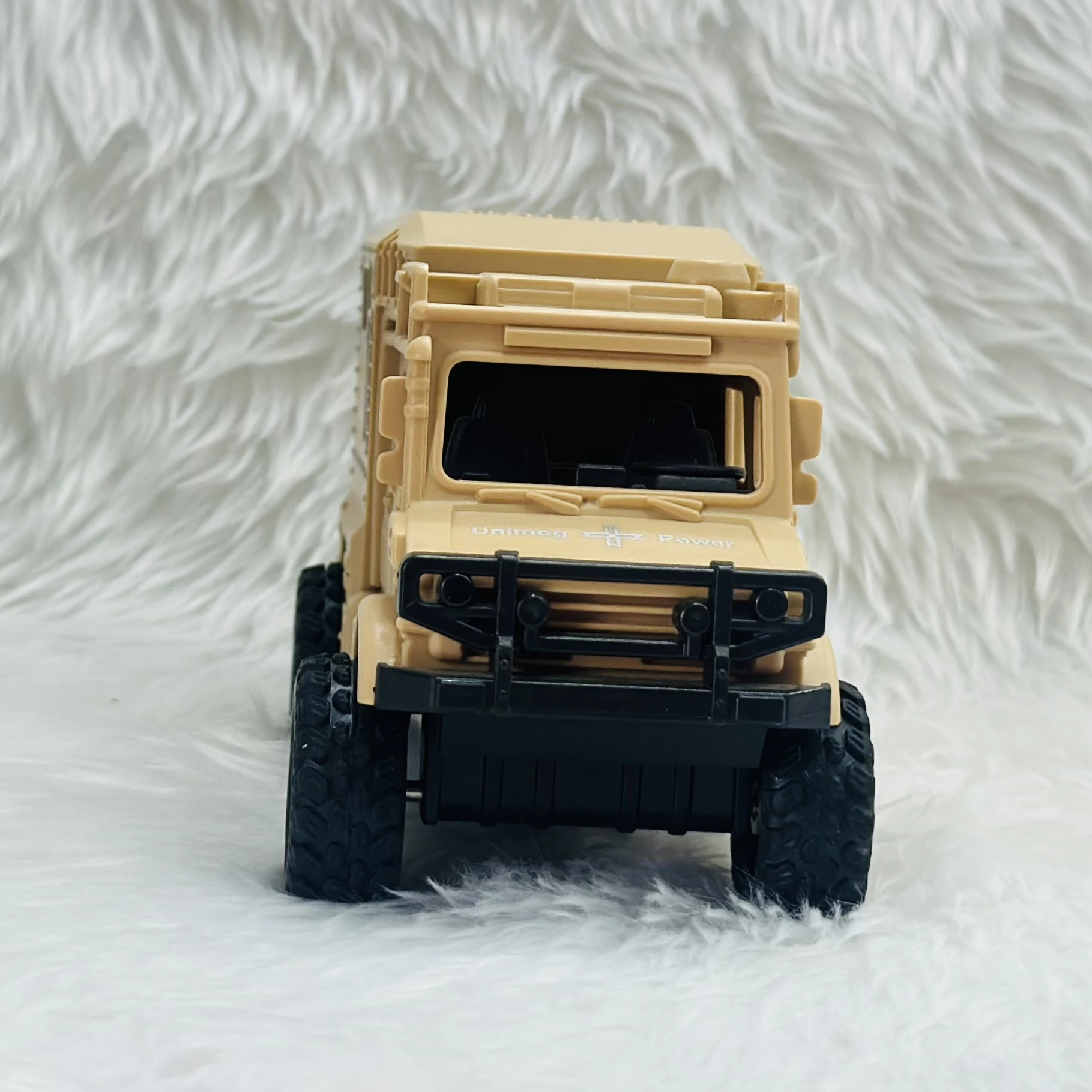Toy Club Unimog army truck toy.