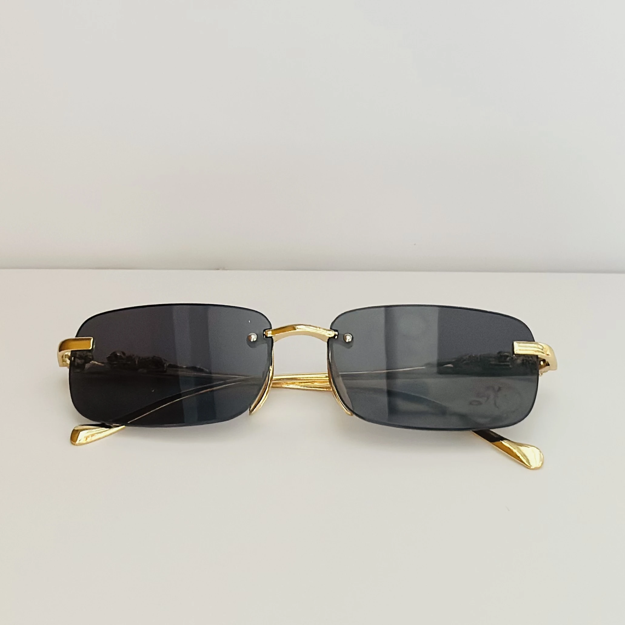 Gucci GG1221S 001 rimless rectangular sunglasses