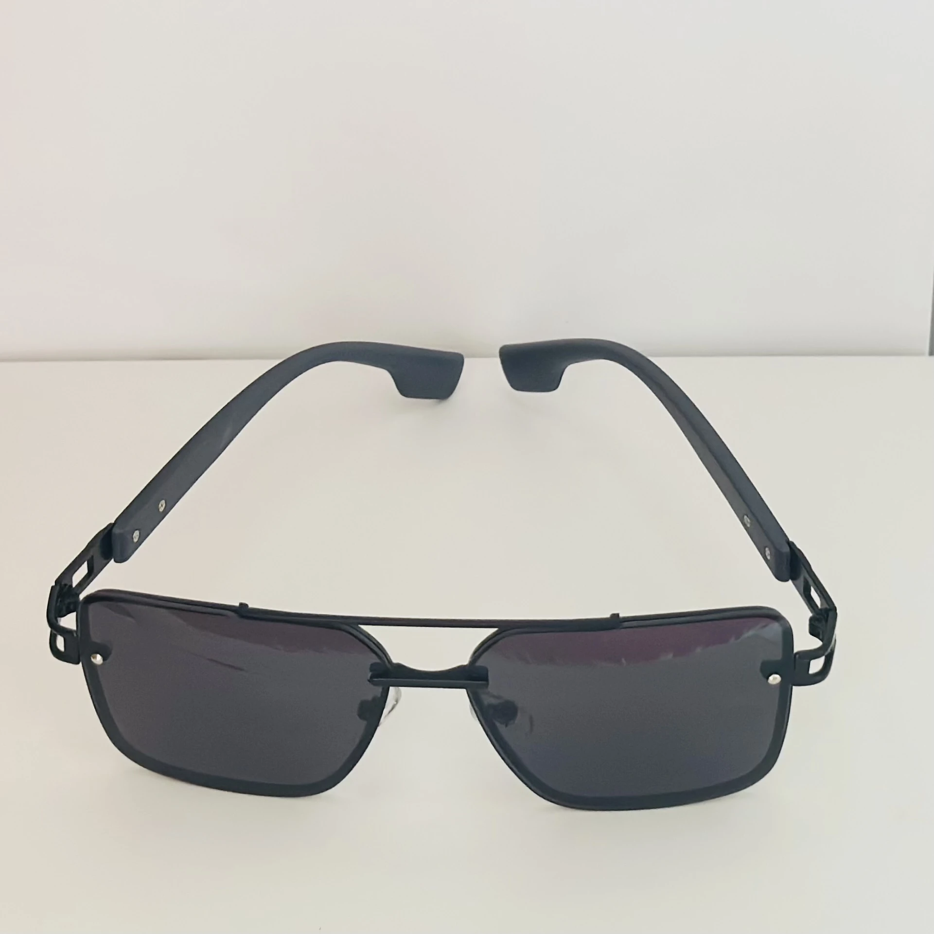 pair of black metal rectangular sunglasses.