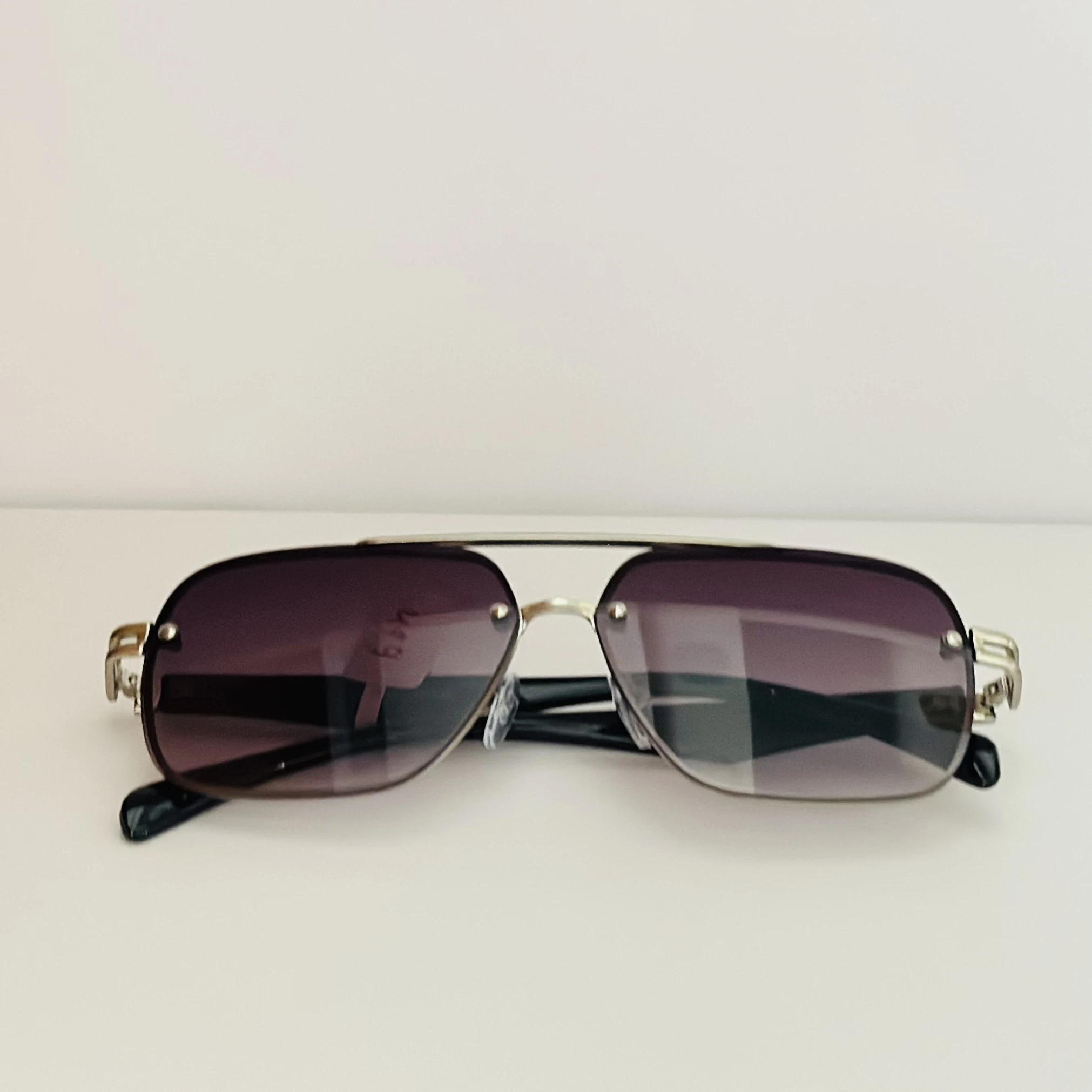 gradient square sunglasses with a black frame.