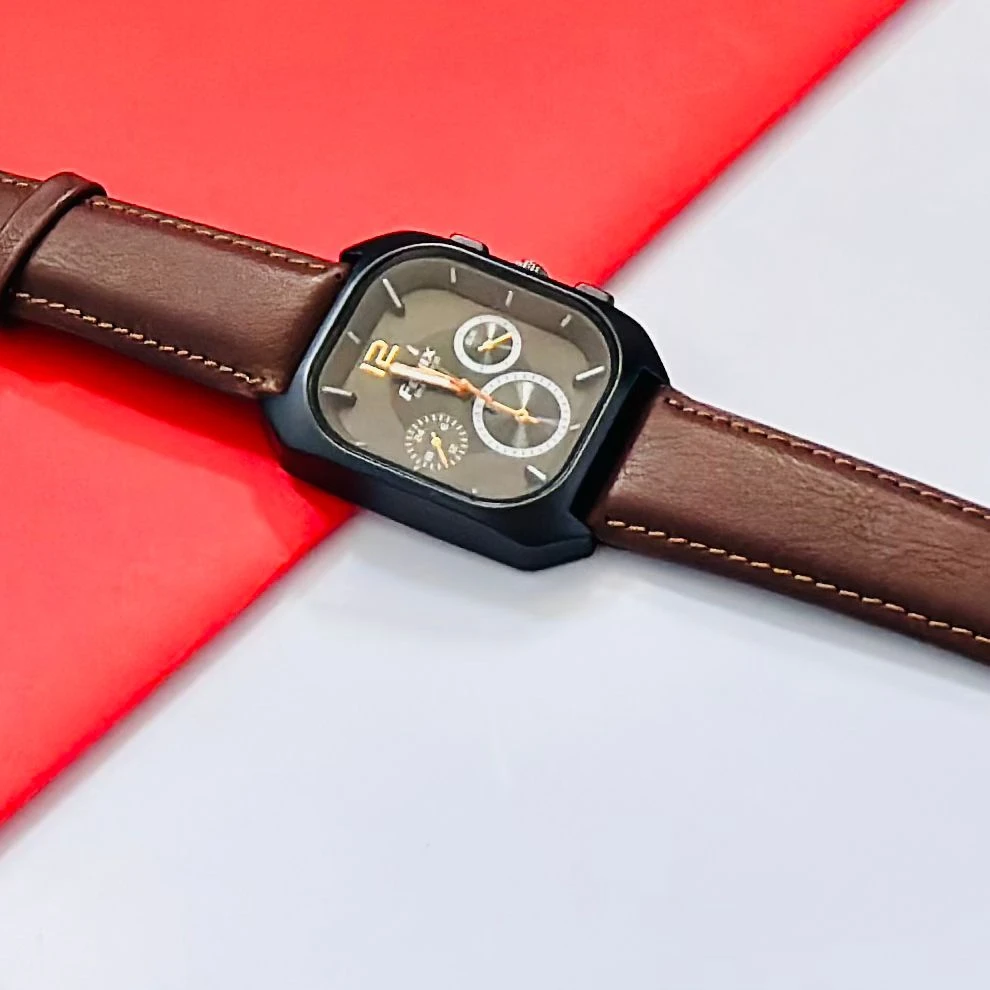 Analog watch with a brown leather strap