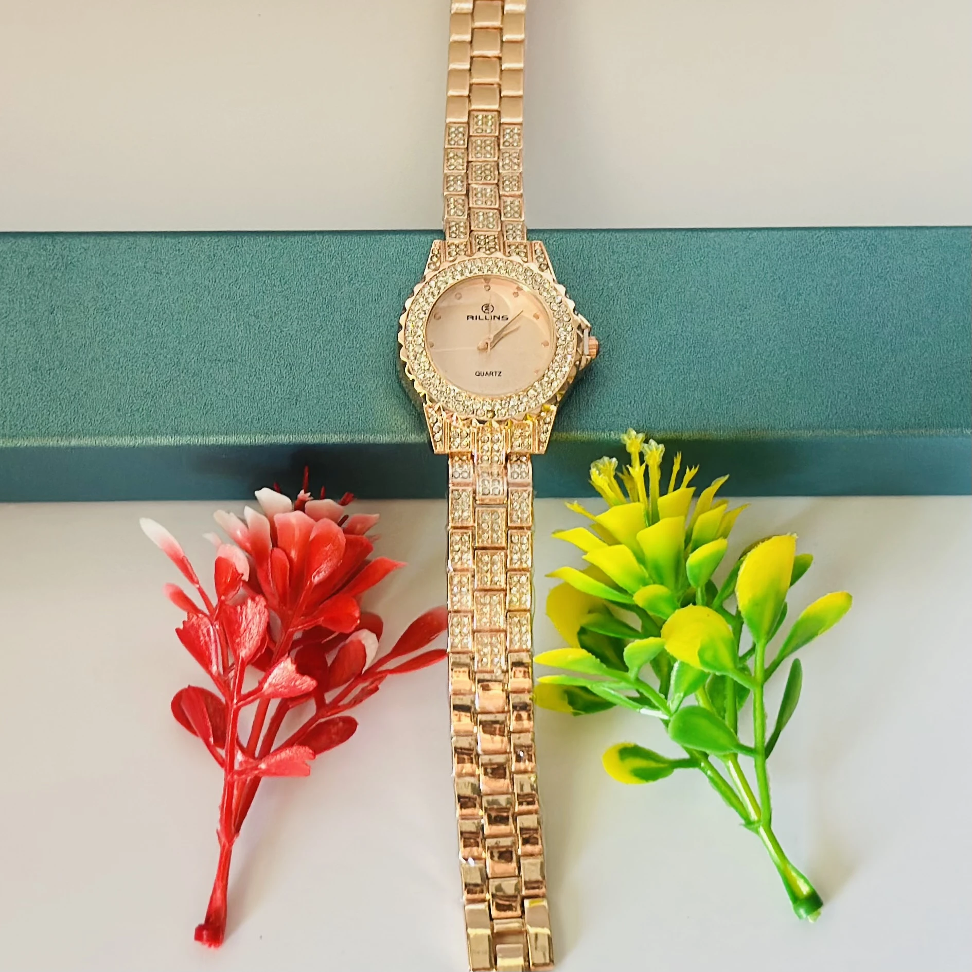 ladies' quartz watch with a gold-tone crystal bracelet.