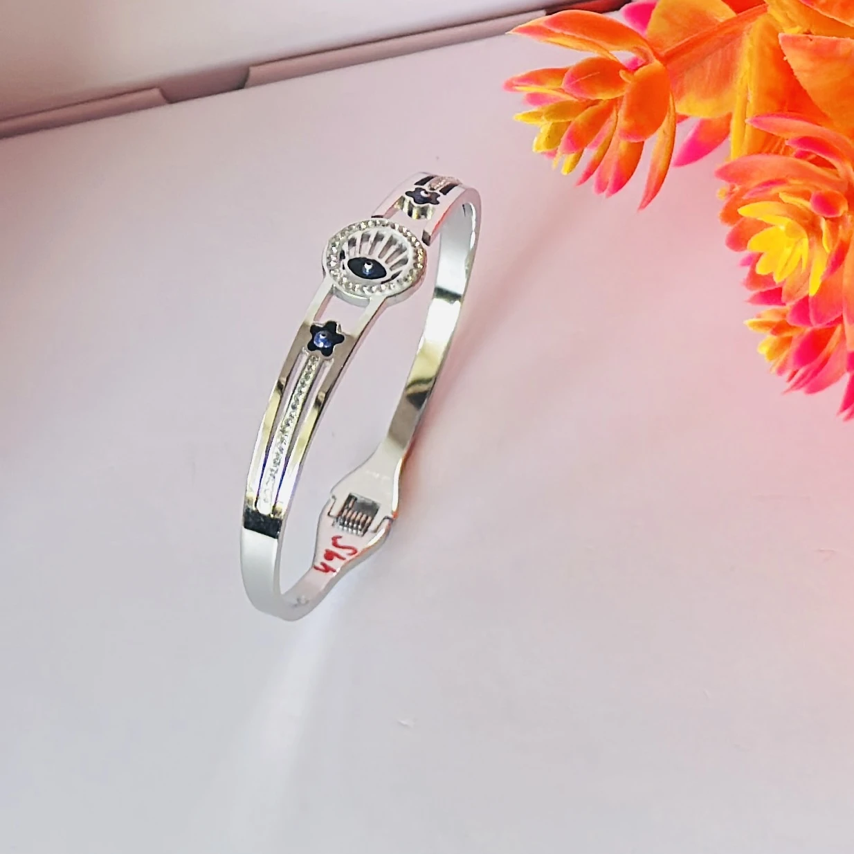stainless steel silver-plated evil eye bangle bracelet.