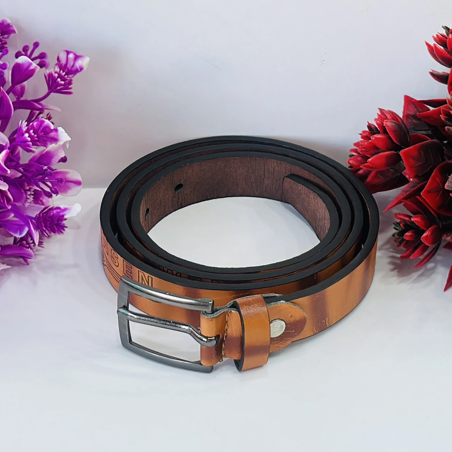 Roadster men's leather formal belt in a tan color.