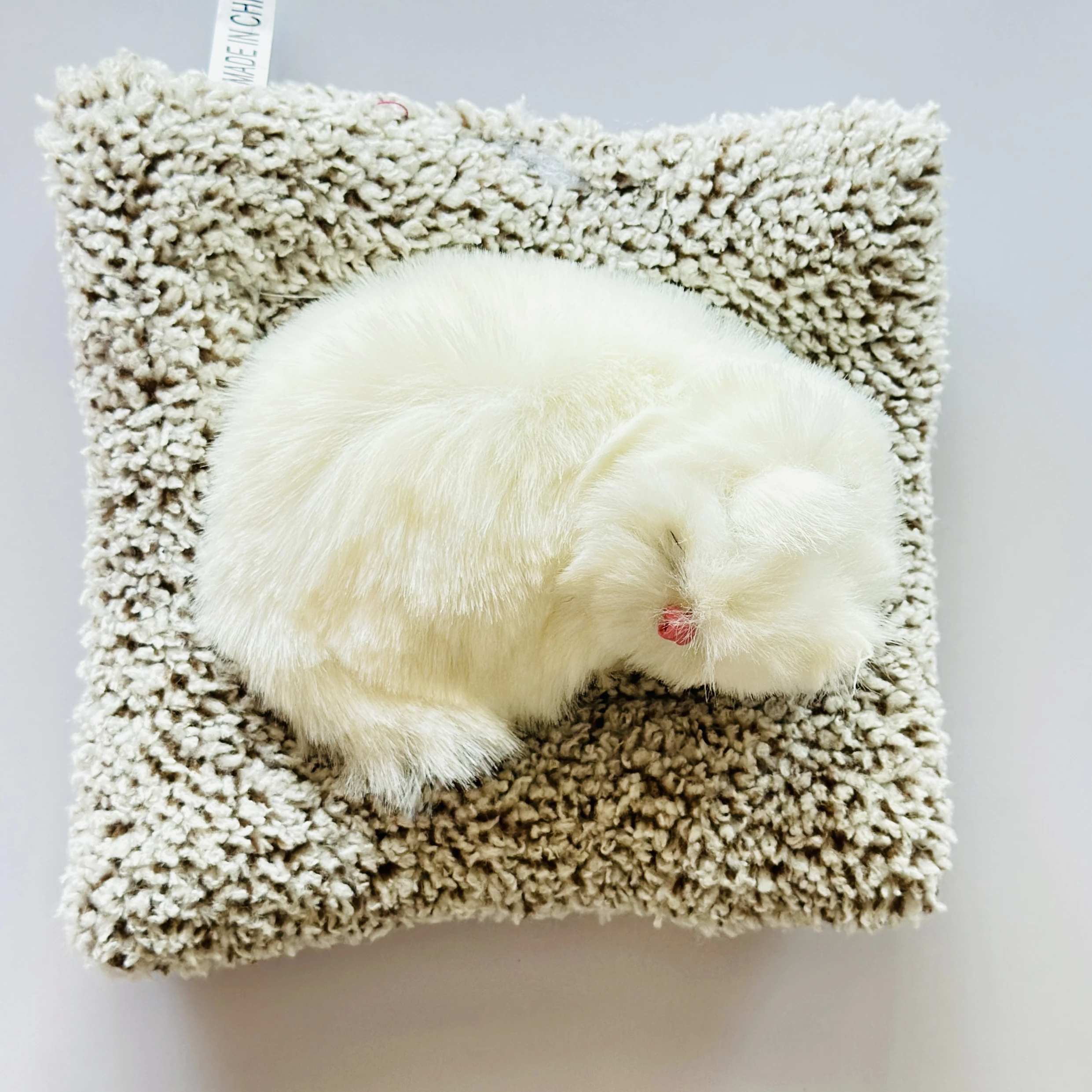 decorative sleeping cat figurine designed for car dashboards or home decor