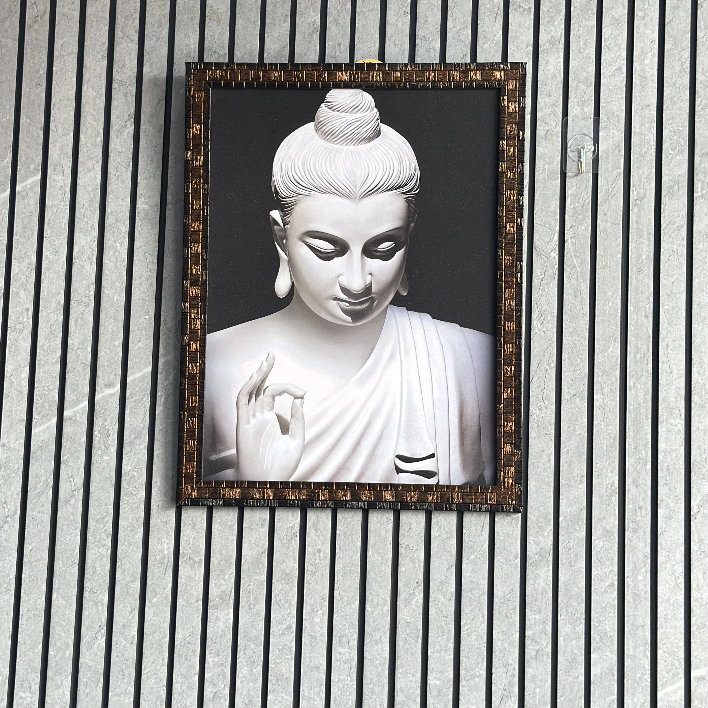 Wall art depicting a statue of Buddha. (SKU-AMKNZY)